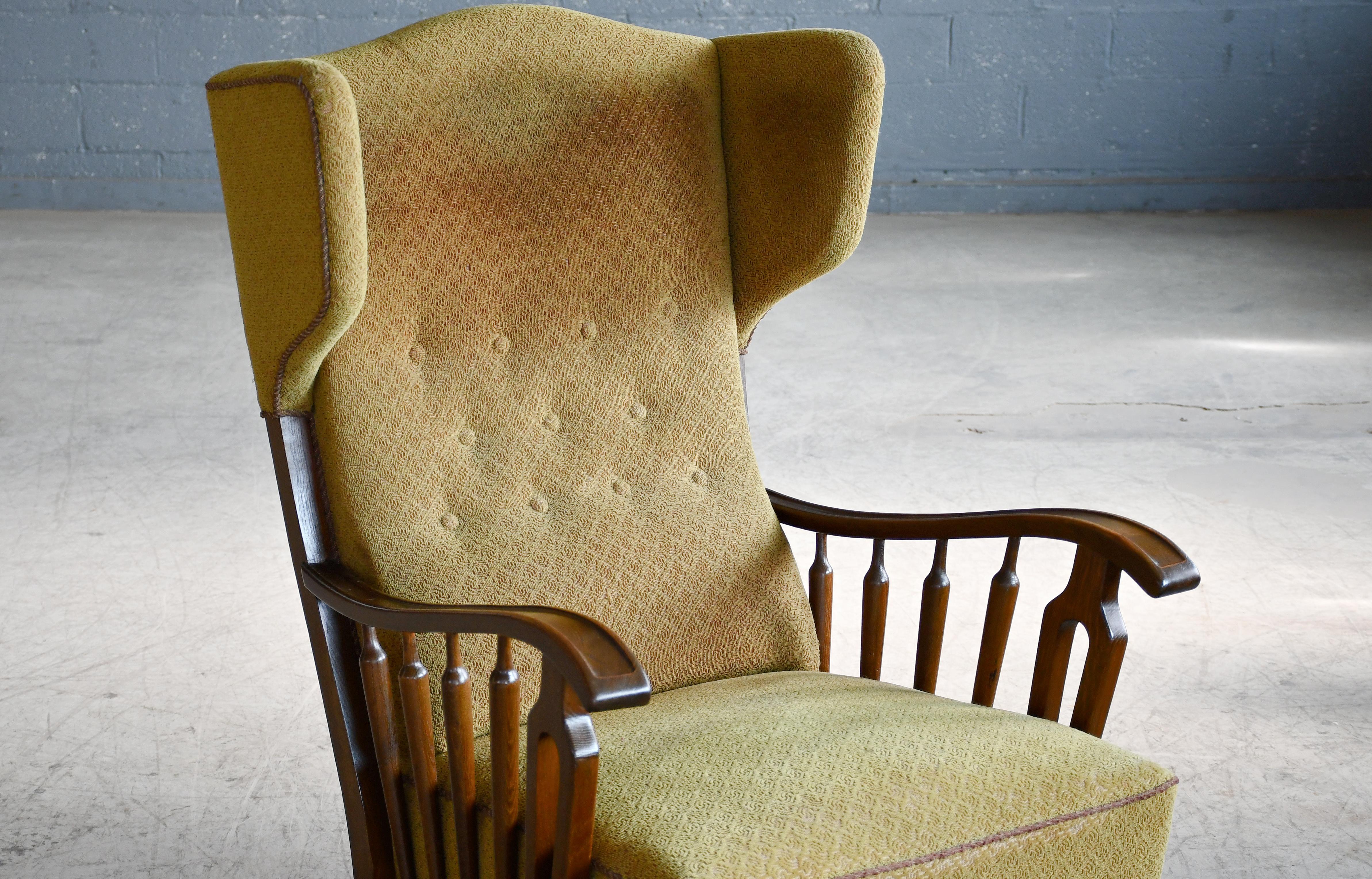 Danish Modern 1950s Highback Lounge Wing Chair With Wooden Armrests In Good Condition For Sale In Bridgeport, CT