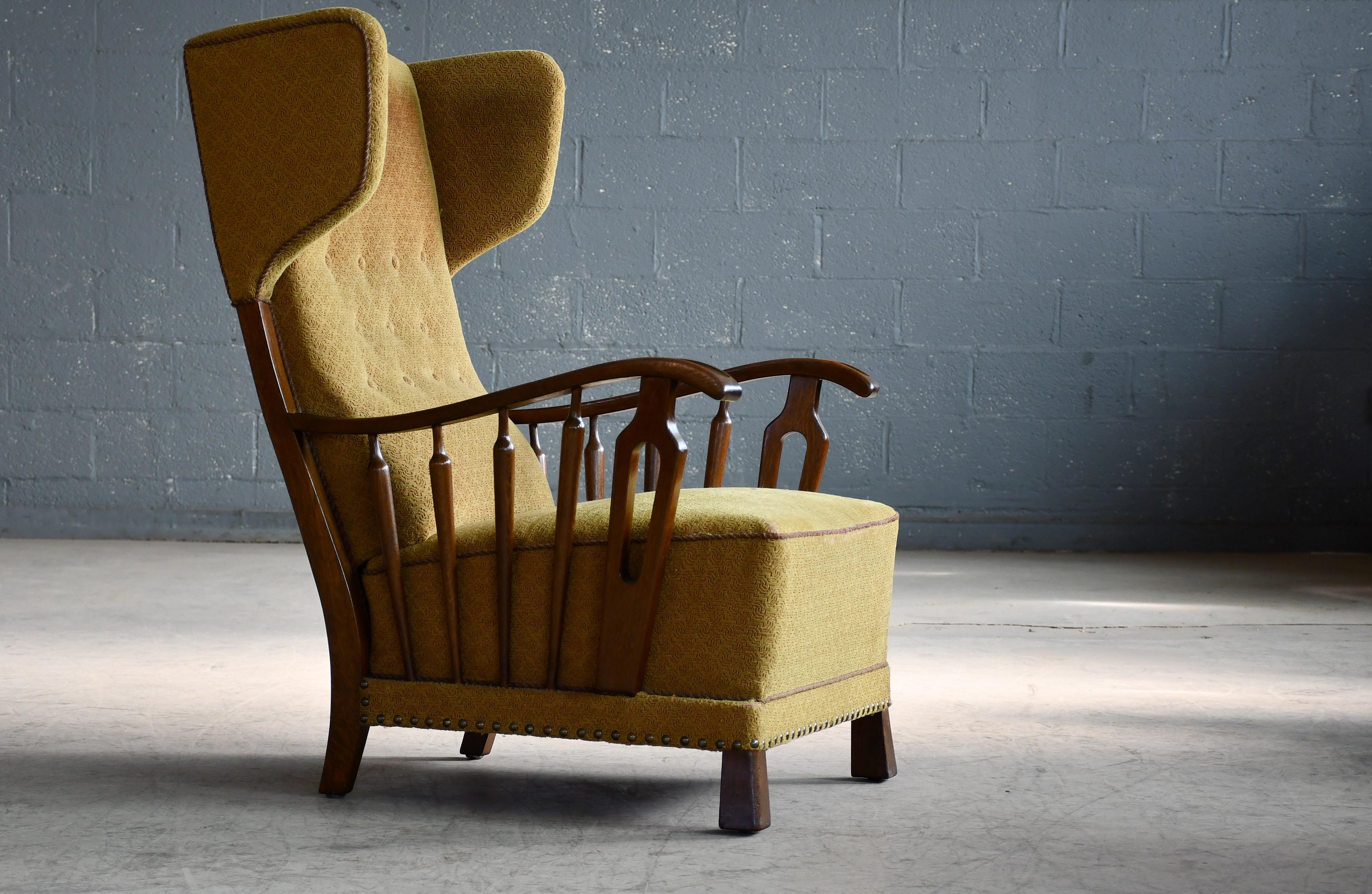 Mid-20th Century Danish Modern 1950s Highback Lounge Wing Chair With Wooden Armrests For Sale