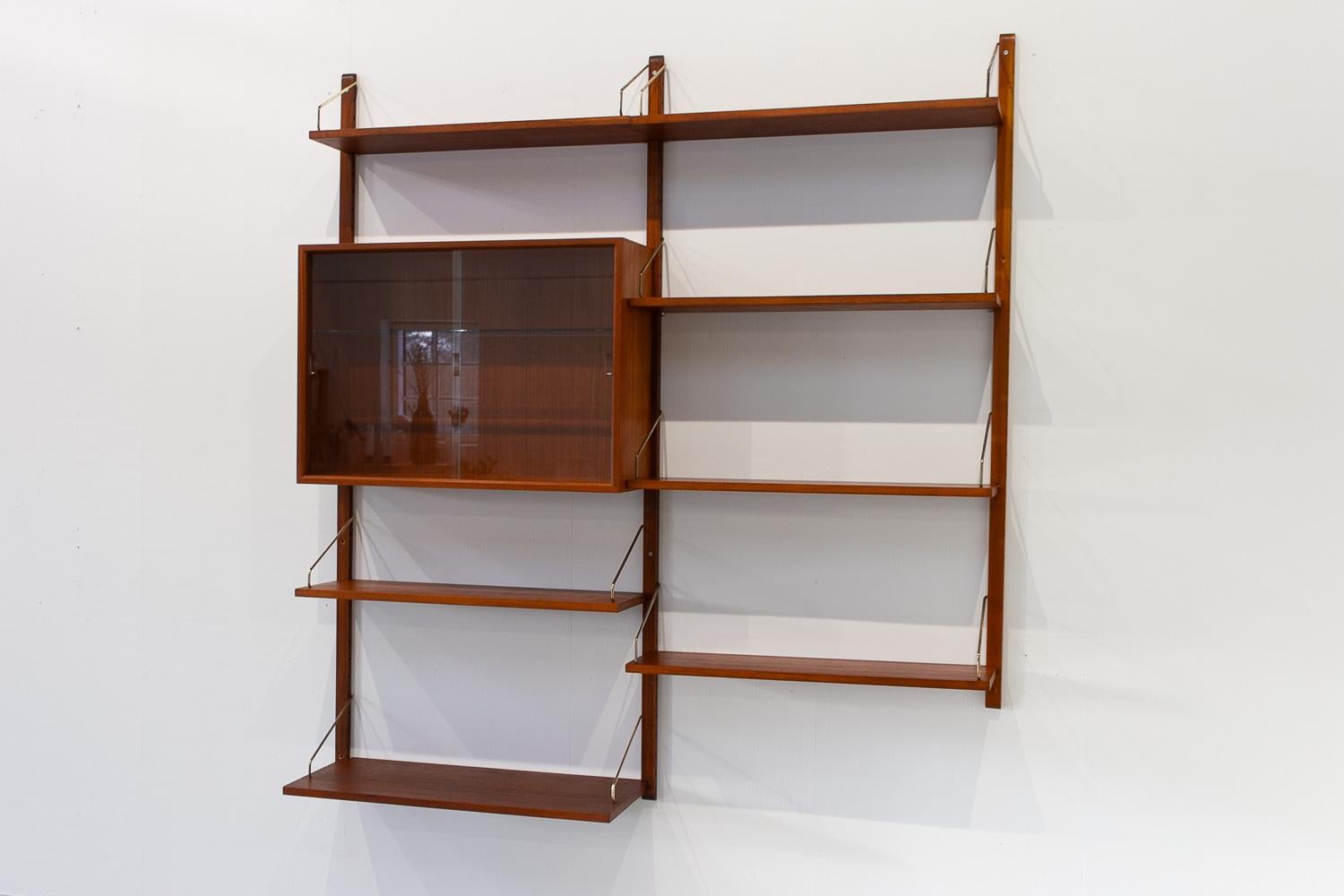 Danish Modern 2-Bay Modular Teak Wall Unit by Poul Cadovius for Cado, 1950s.

Mid-Century Modern 2 bay shelving system model Royal. This is an original vintage floating bookcase designed in 1948 by Danish architect Poul Cadovius. 
Cadovius had the