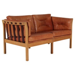 Danish Modern 2-seater Sofa of Oak with Cognac Colored Leather Cushions + Strips