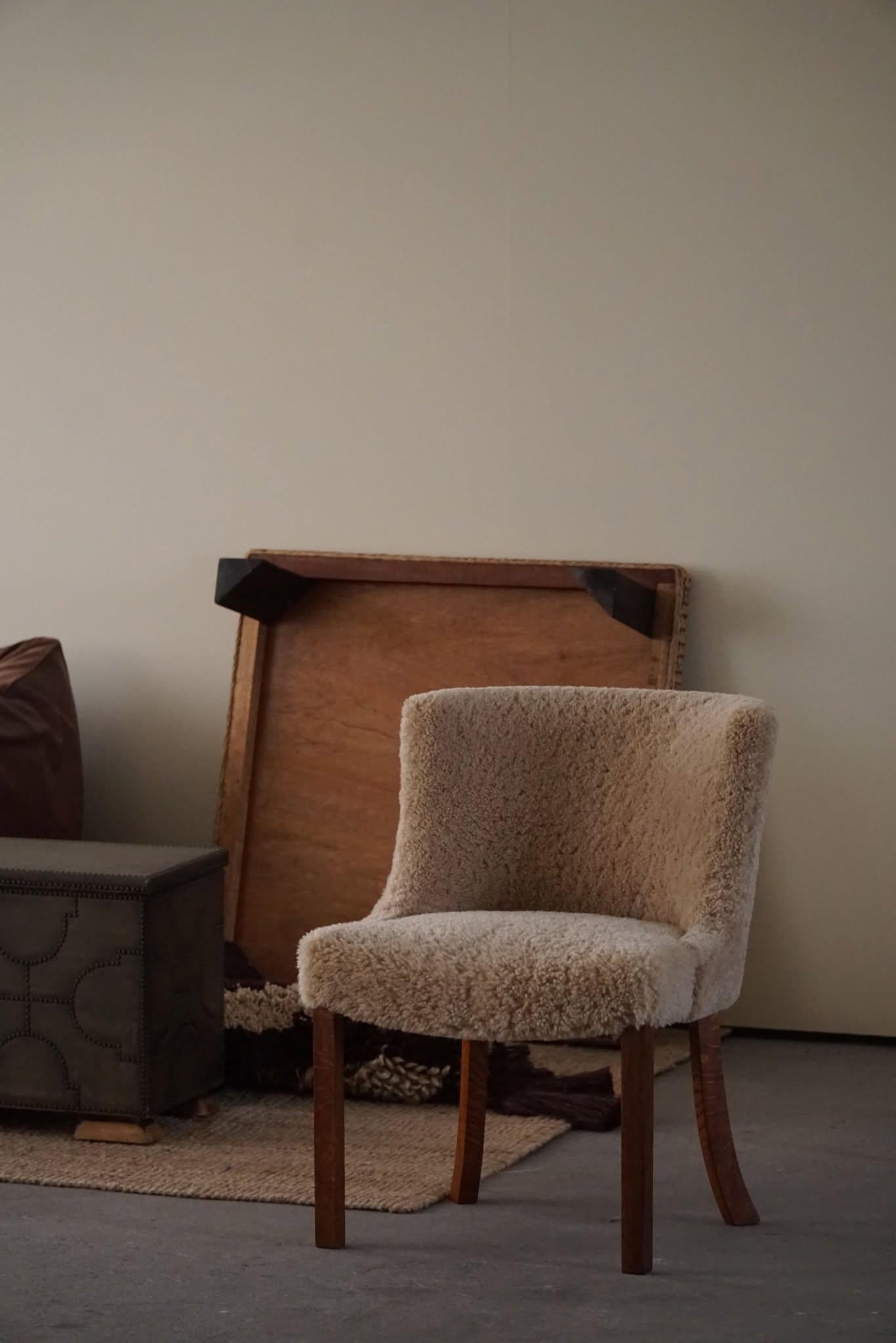 A rare classic chair / desk chair, attributed to Kaj Gottlob for Fritz Hansen. Made in the 1940 - 1950s. Newly reupholstered in a great quality shearling lambswool, elegant shaped legs made in solid oak. The general impression is really good. This