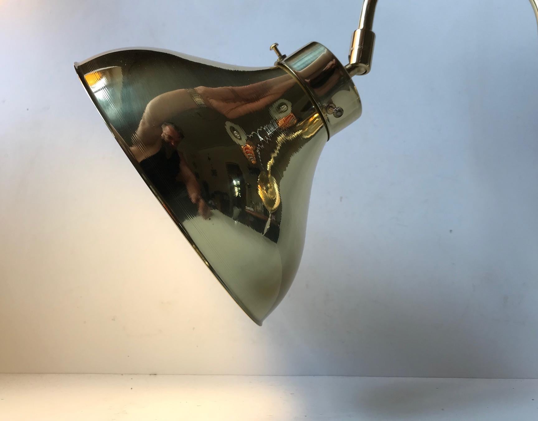 Fully adjustable brass wall light - sconce manufactured and designed by Abo Metalkunst in a style reminiscent of Hans Agne Jakobsson. The condition is NOS (new old stock) and it has never been installed nor used. It has an on/off switch to the cord