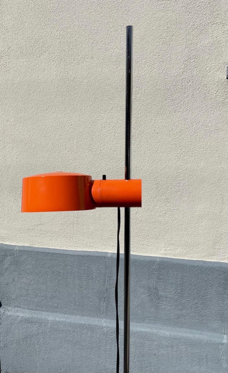 Space Age floor lamp. It features a chromed steel stem and a sliding height adjustable orange lamp shade I acrylic. It was designed by the Danish Architect Svend Middelboe and manufactured by Nordisk Solar in Denmark during the 1970s. The shade also
