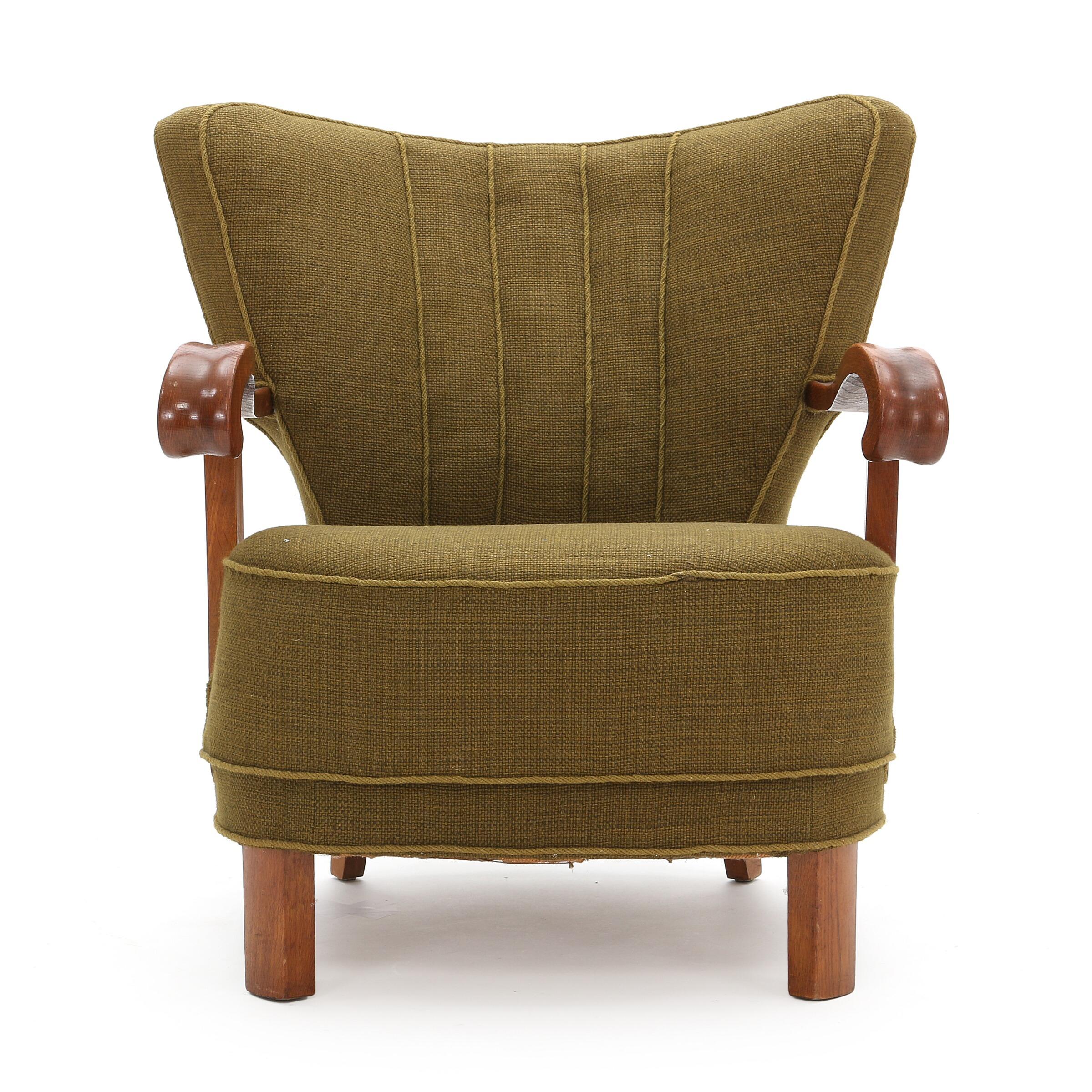 Substantial Danish Modern armchair in oak, back legs of stained beech. Seat and back upholstered with green wool. Made 1940s. Great form and very comfortable.
