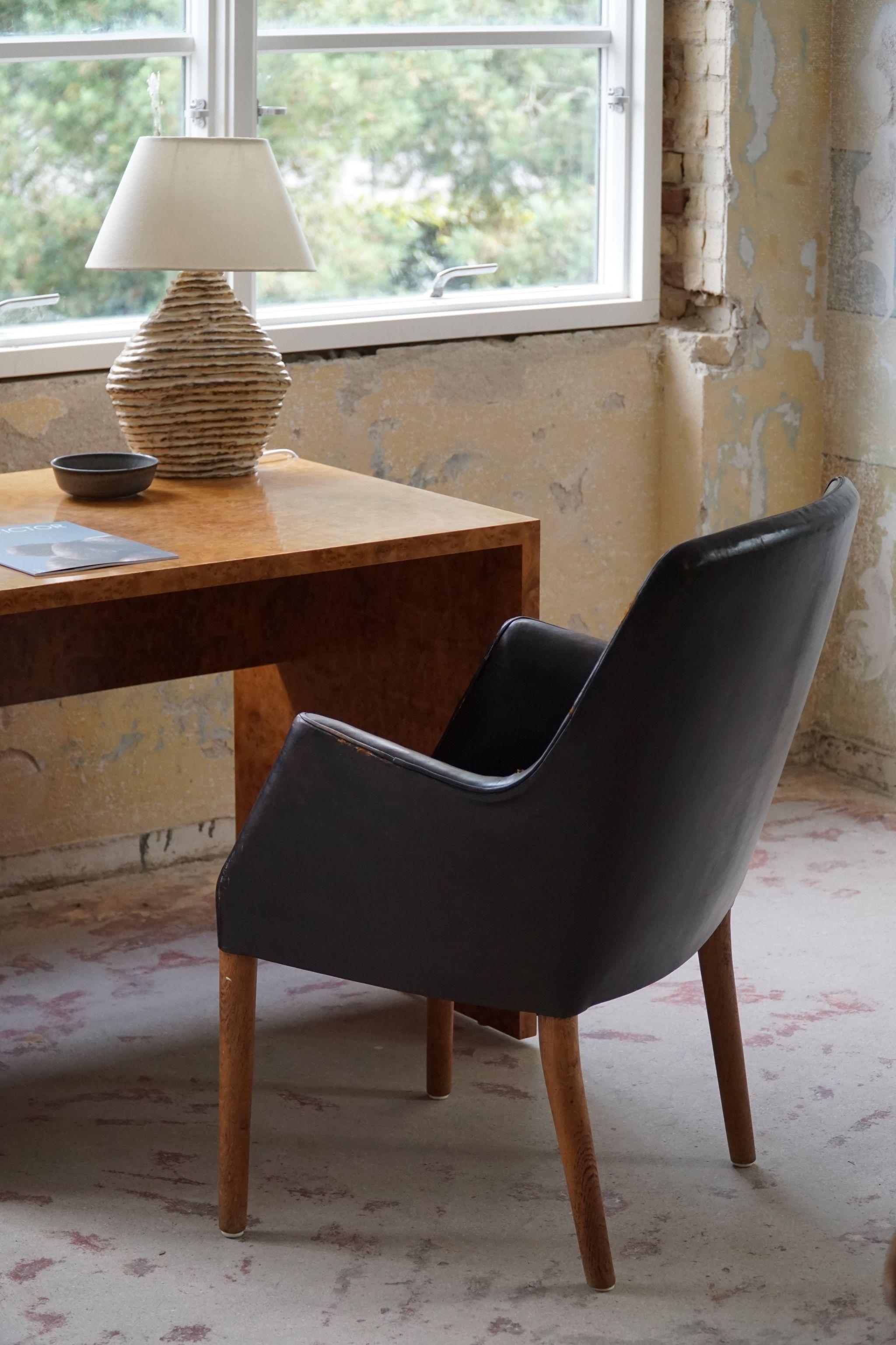 Scandinavian Modern Danish Modern Armchair by Nanna Ditzel in Oak and Patinated Leather, 1950s For Sale