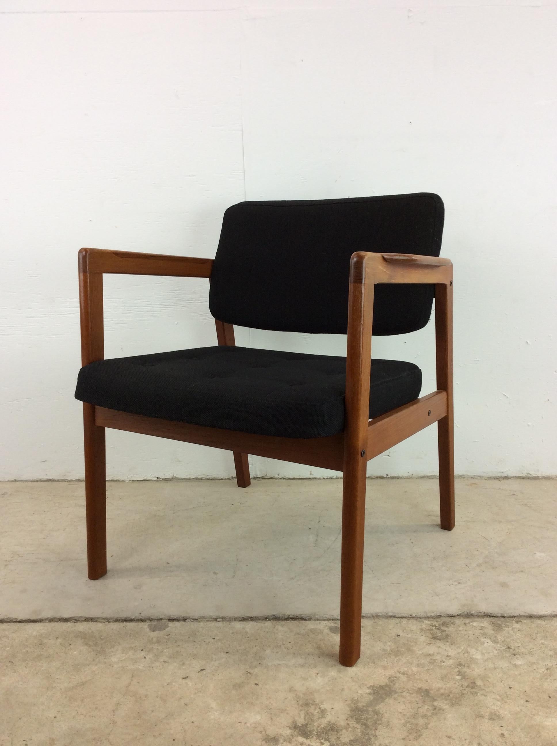 This Danish Modern arm chair features solid teak frame with original finish, vintage black upholstery with tufted seat back, and tall tapered legs.

Complimentary Danish modern office furniture available separately.

Dimensions: 26w 25d 30h 17.25sh