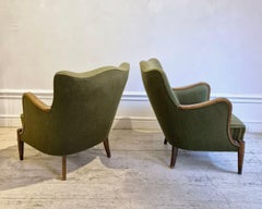 Danish Modern armchairs by Alfred Christensen. Beautiful shape, brass feet.