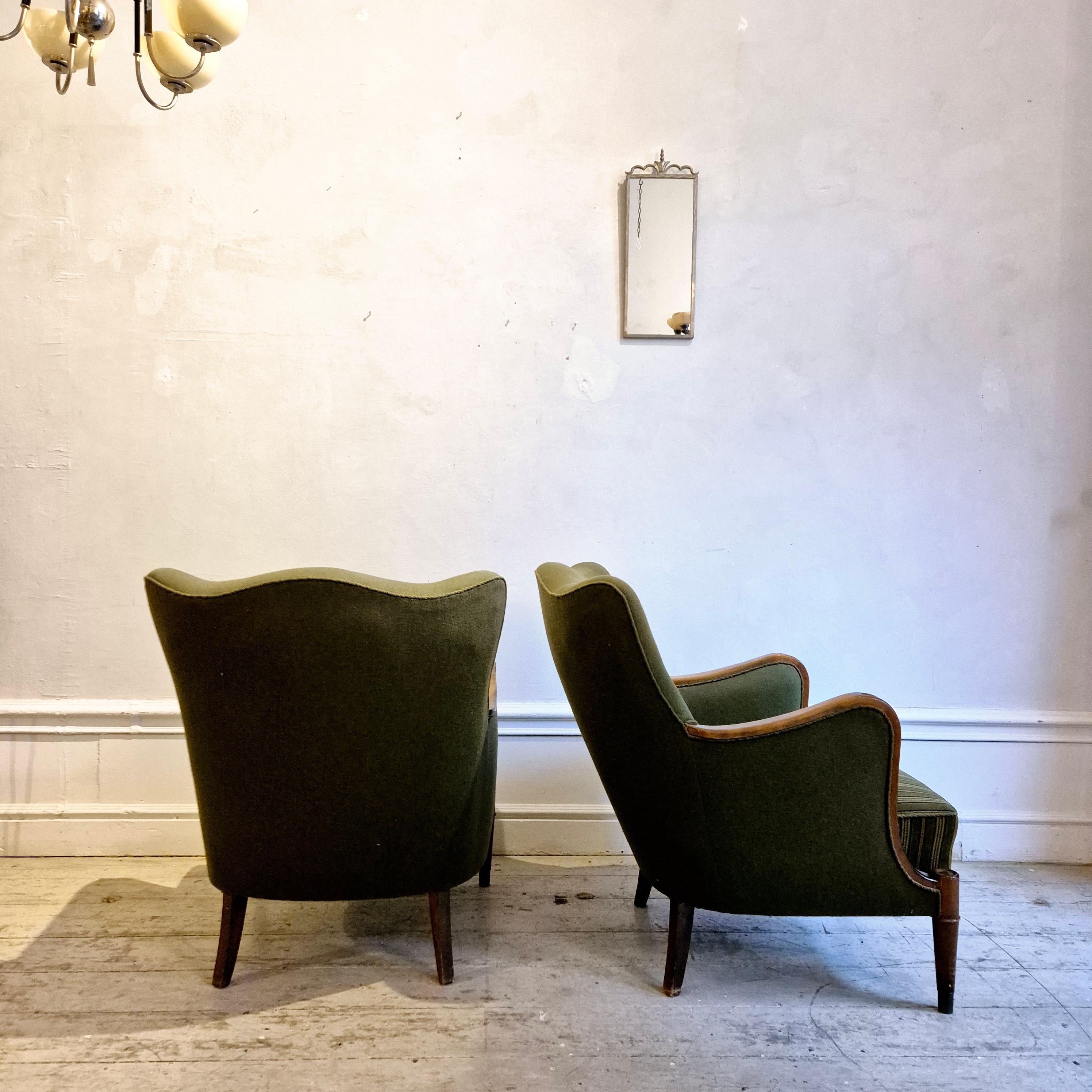 Danish Modern armchairs by Alfred Christensen. Beautiful shape, brass feet. In Fair Condition For Sale In Stockholm, SE