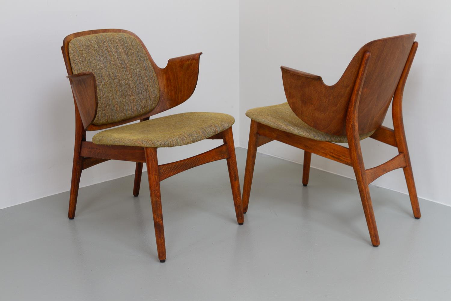 Danish Modern Armchairs by Hans Olsen for Bramin, 1950s. Set of 2.
Pair of Danish Mid-Century Modern Model 107 lounge chairs in stained oak by Danish architect Hans Olsen for Bramin, Denmark. 
Back and armrests in one piece of shaped laminated wood.
