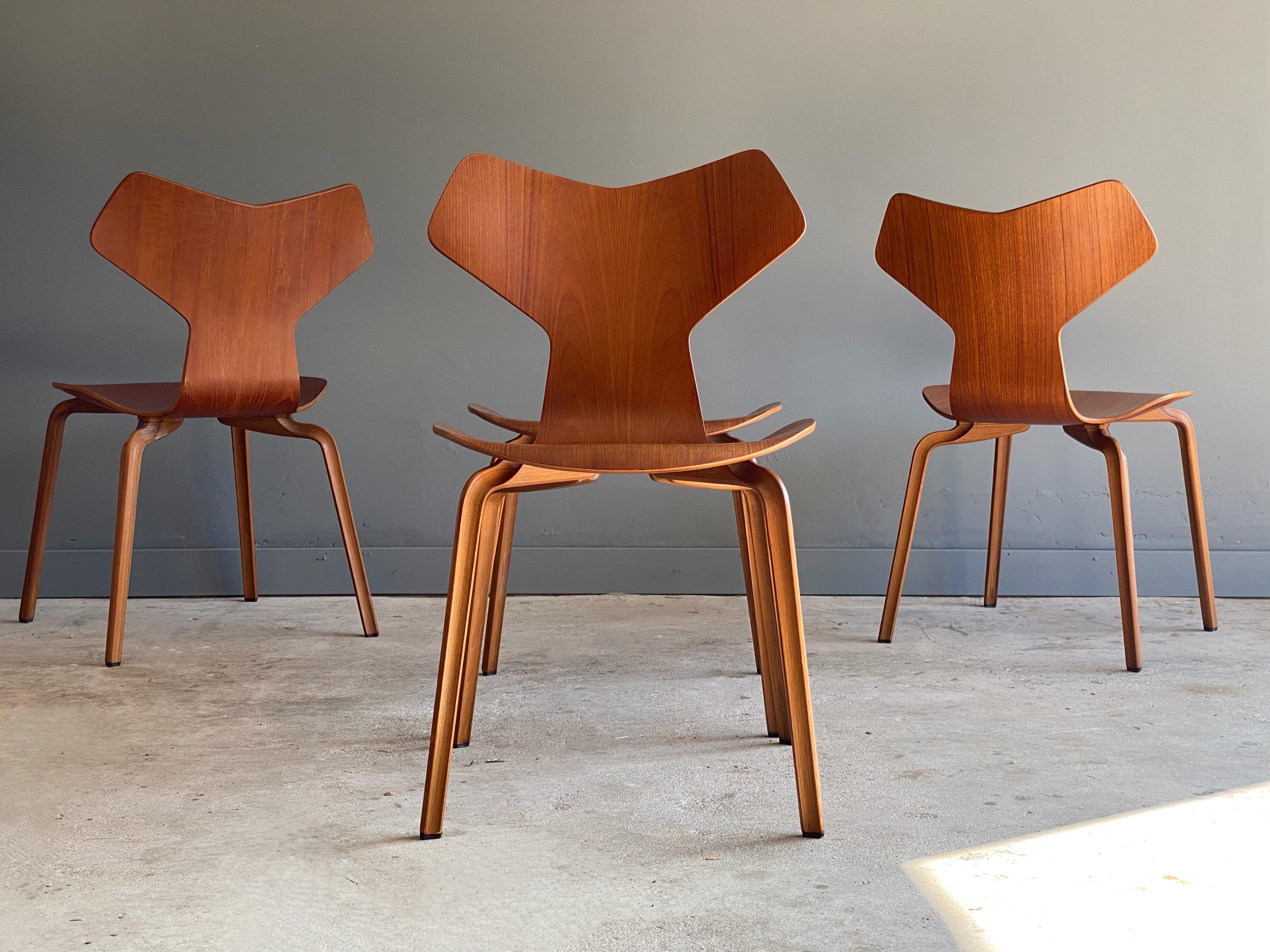Iconic set of Arne Jacobsen “Grand Prix” chairs. Originally known as the Model 4130, the chair was renamed after it won the Grand Prix at the XI. Triennale di Milano in 1957. The chair is produced by Fritz Hansen out of teak. These early example