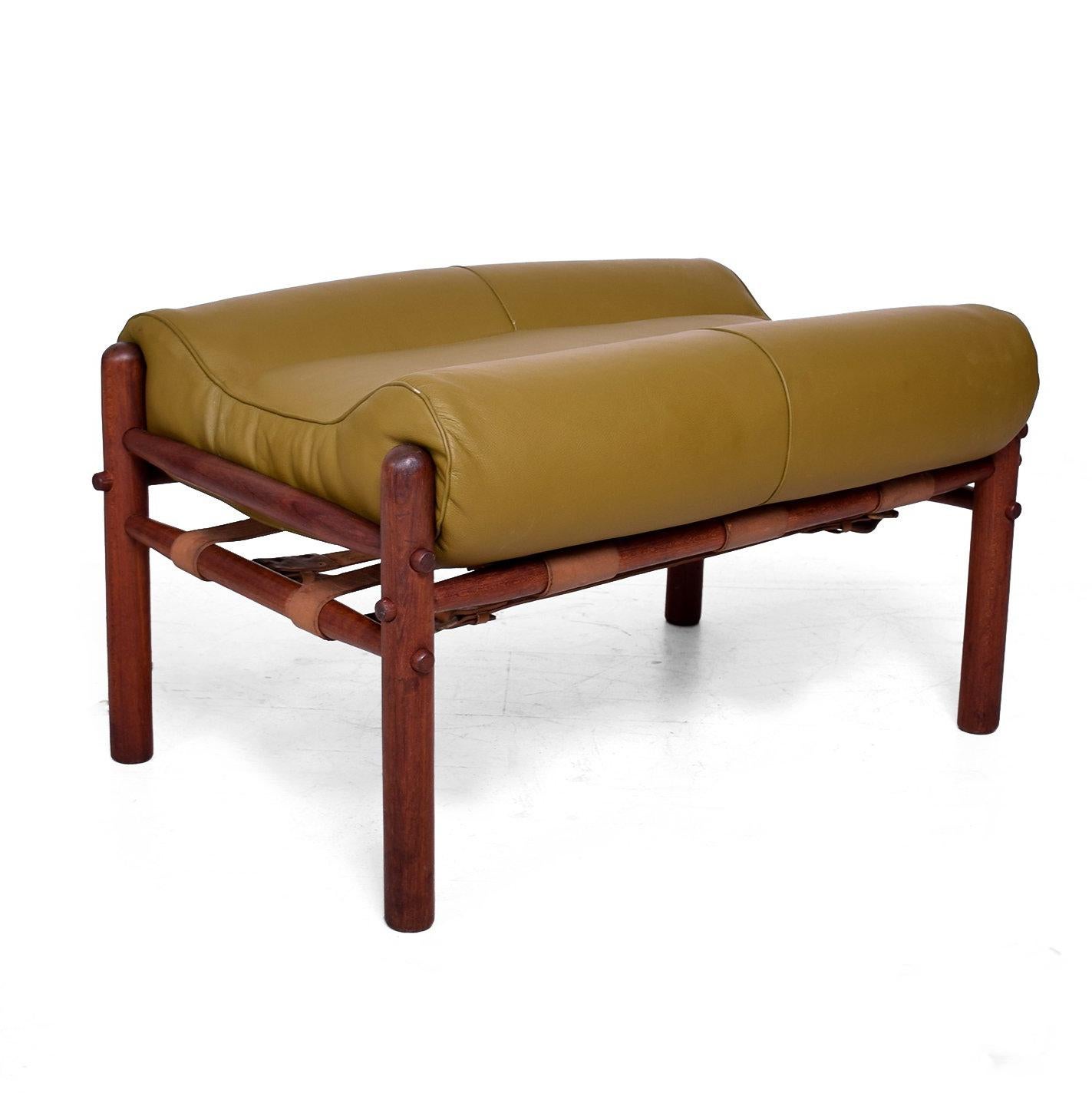 For your consideration a  Kontiki safari chair and ottoman by Arne Norrel,

Denmark, circa 1960s.
Measures:
Chairs: 30" H x 33" D x 34" W, seat: 18" H.
Ottoman: 17" H x 31" W x 21" D. 

Unmarked. 

