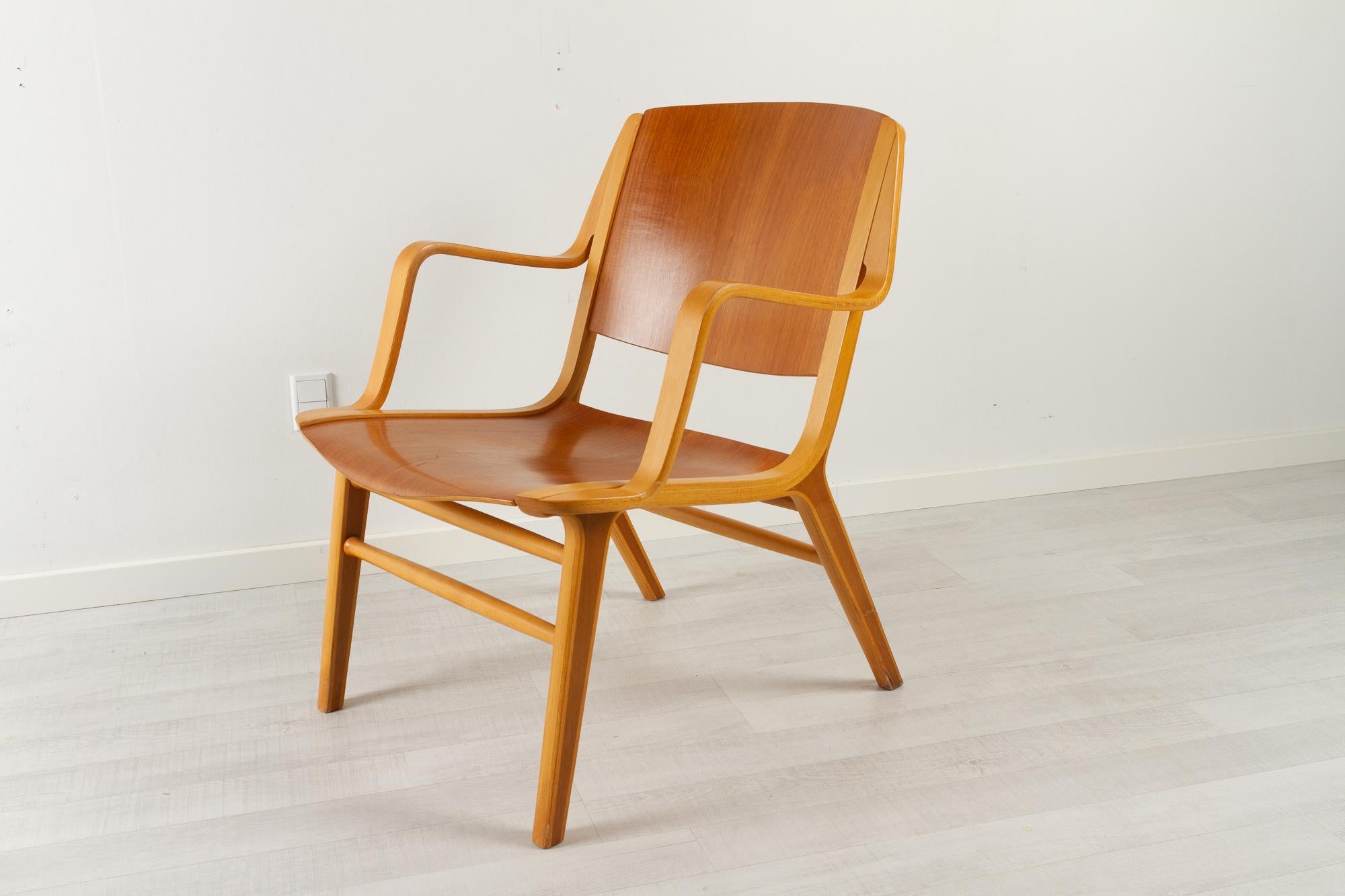 Danish modern axe armchair by Hvidt & Mølgaard 1960s
Danish Mid-Century Modern easy chair designed by Peter Hvidt and Orla Mølgaard-Nielsen in 1947 and manufactured by Fritz Hansen, Denmark in 1966.

Beautiful and elegant lounge chair named the