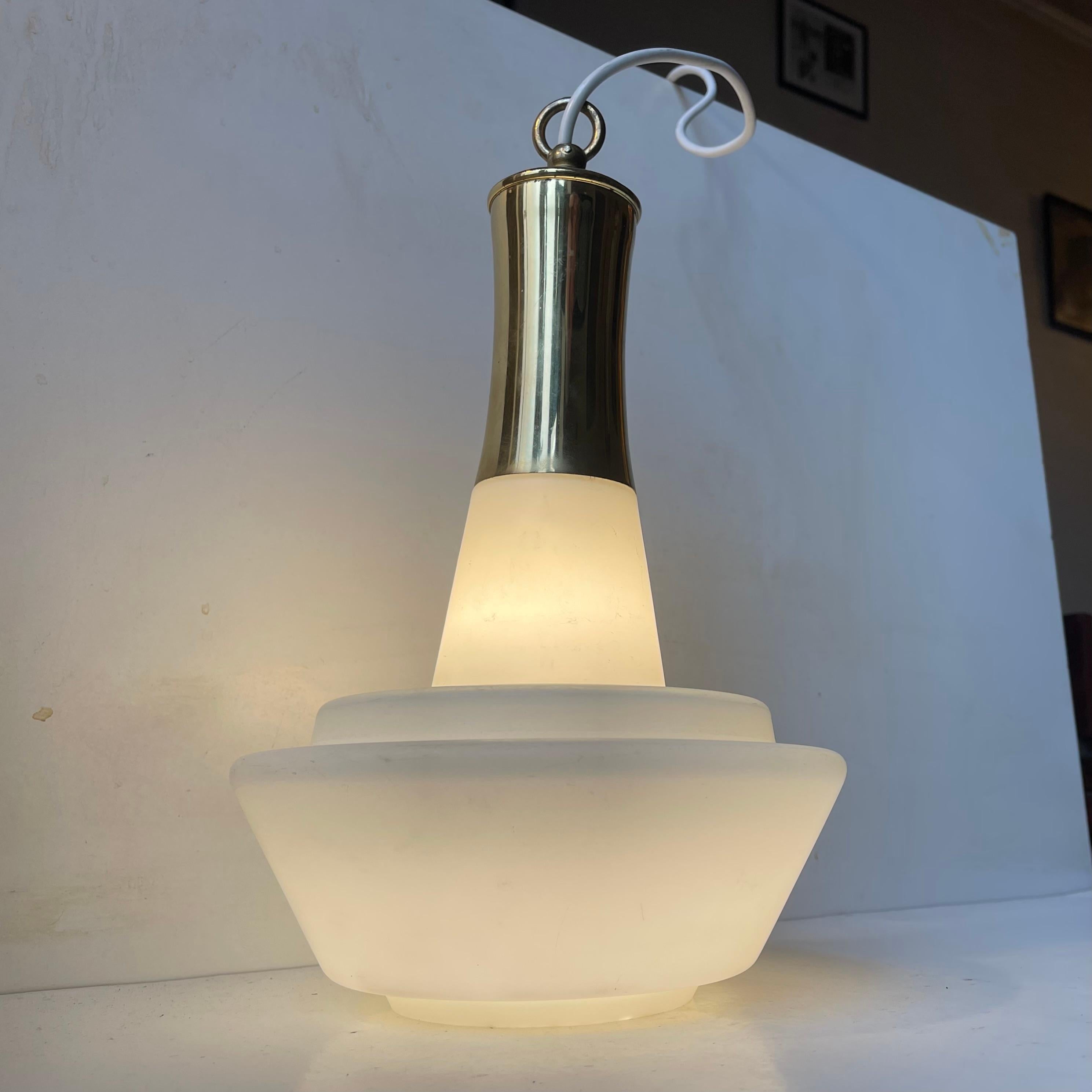 A sculptural ballerina shaped pendant ligh composed of tiered white opaline glass shade and a decorative brass top. It was manufactured by Lyft in Denmark circa 1950-60 in a style reminiscent of Vilhelm Lauritzen and Hans Agen Jakobsson.
