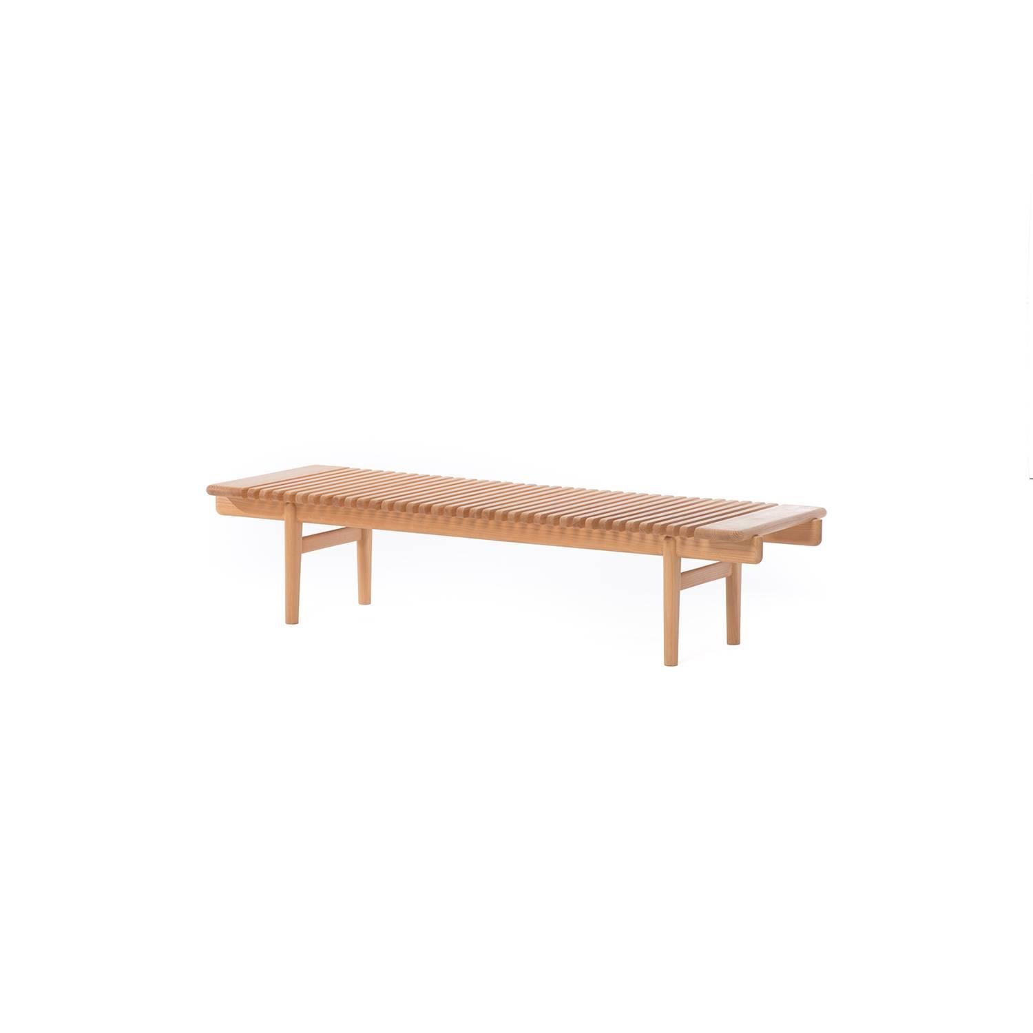 This classic Hans Wegner bar bench in ash is a standout piece that can function as a bench, or as a coffee table.