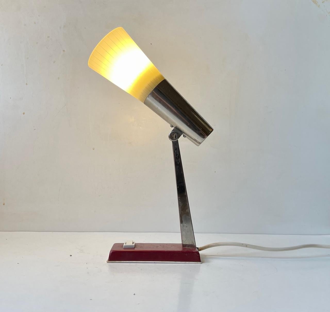 Small adjustable bedside table light with pin-striped hand-blown glass shade, maroon base and chrome plated stem. Designed and manufactured in Denmark in the 1950s by Voss. Measurements: H: 24 cm, Dept: 20 cm, Diameter: 8 cm (shade). For the US. It