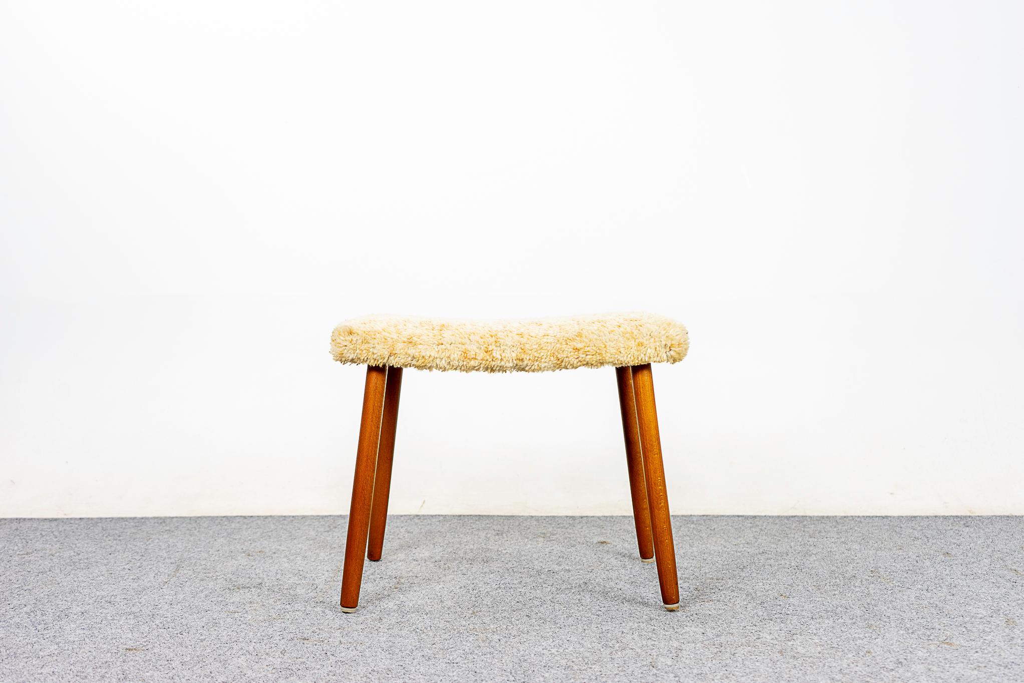 Beech wood Danish footstool, circa 1960's. Can be used with virtually any seating type, easy to move around the home. Original as-is upholstery.