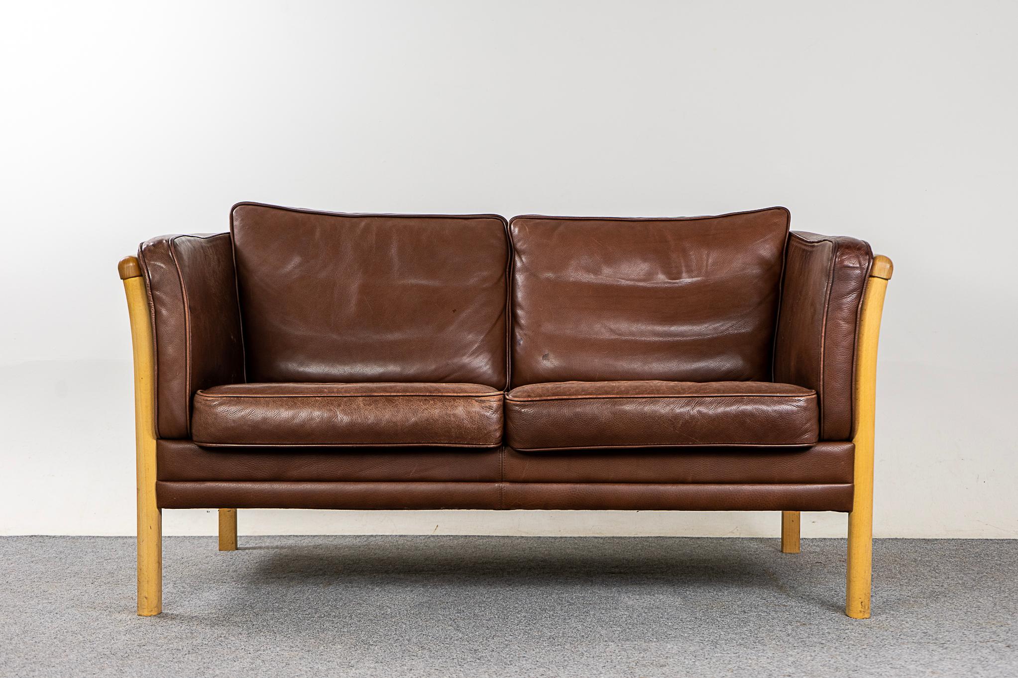 Beech & leather loveseat, circa 1960's. Soft and supple, yet durable enough to ensure years of enjoyment. Solid beech wood frame with stylish slats and removable cushions. Spend the evening in!

Please inquire for international shipping rates.