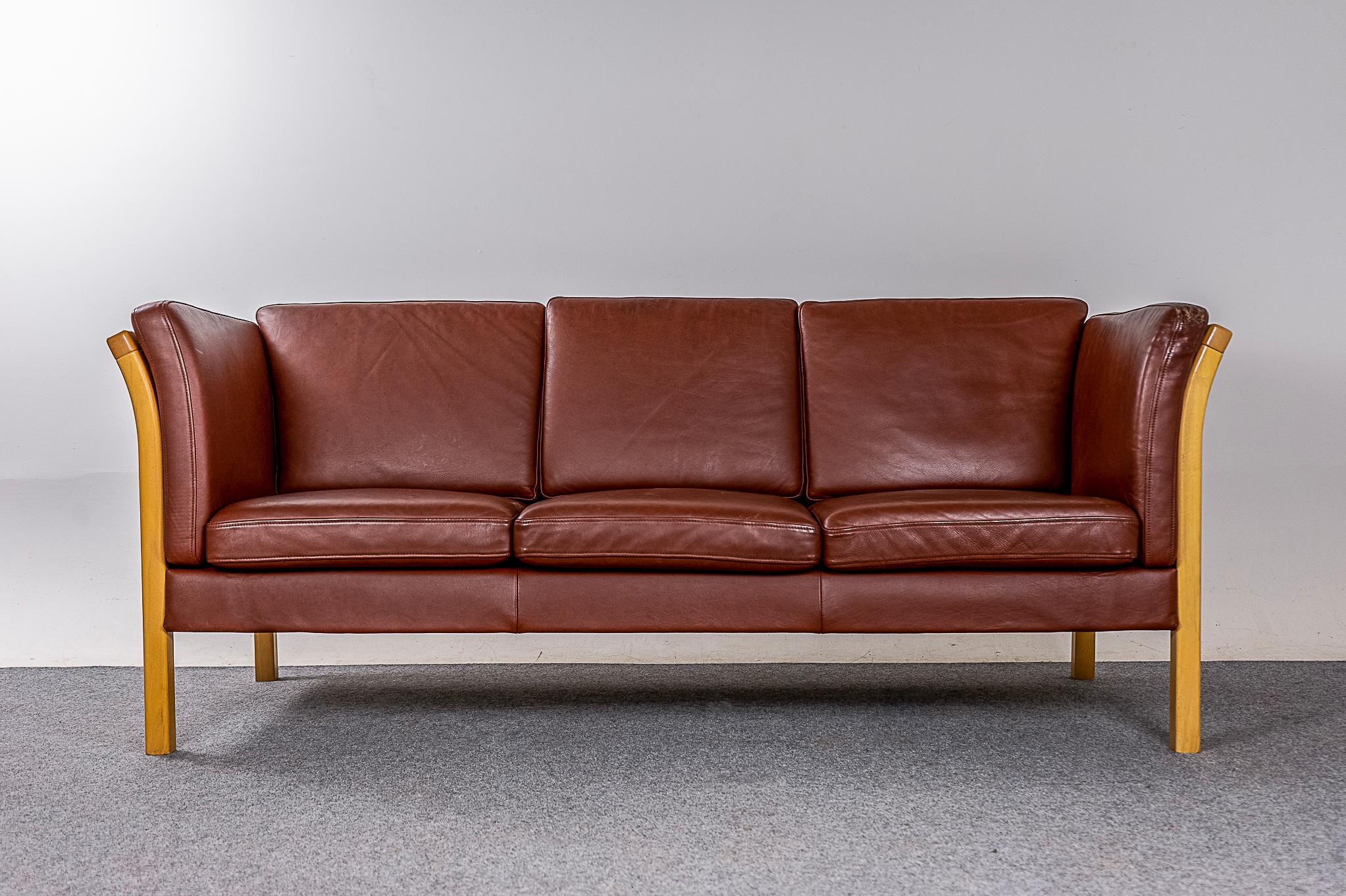 Beech wood & leather Danish sofa, circa 1960's. Original leather is soft and supple while also being durable to ensure years of use and enjoyment. Three seat sofa frame is constructed of solid beech wood with removable cushions on both the seat and