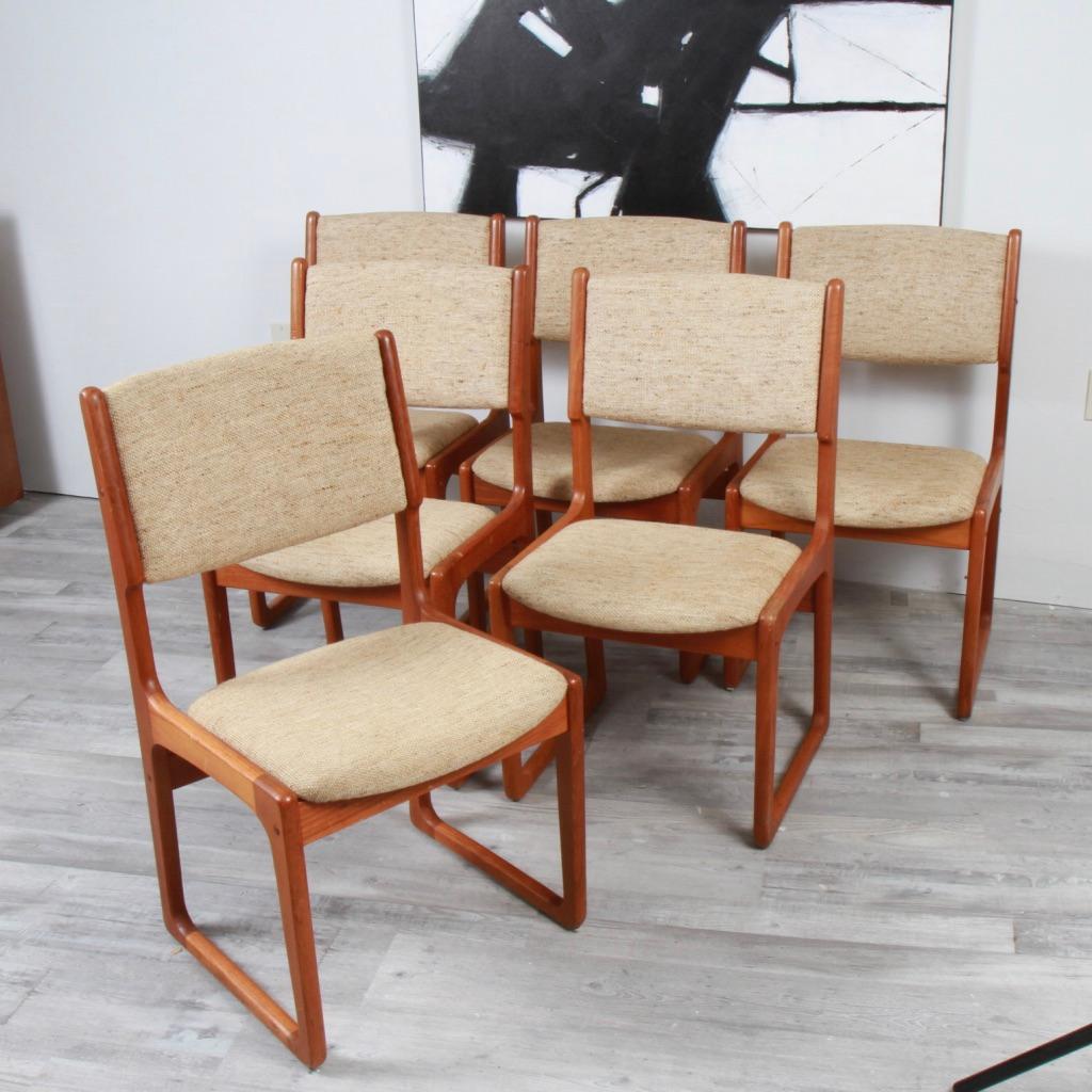 Relatively rare set (except on 1stdibs) of Benny LInden, square sided, solid teak dining chairs from the 70s. Cleann upholstery, but in need of modern updating, this set can easily break out of the Danish modern aesthetic and surround almost any