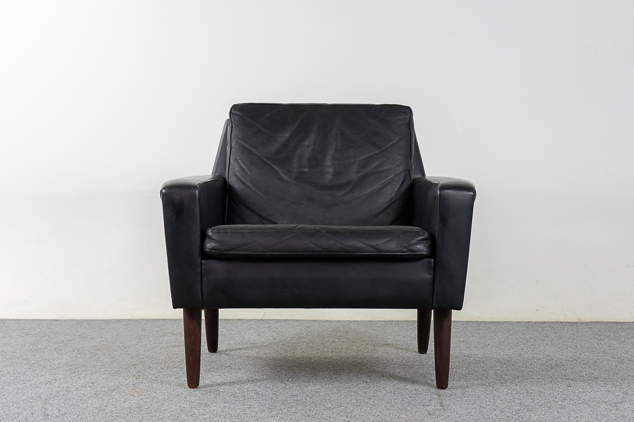 Leather and teak armchair, circa 1960's. Clean, sleek modern lines and original black leather. Very minor wear, lots of life in it yet! 

Please inquire for remote and international shipping rates.