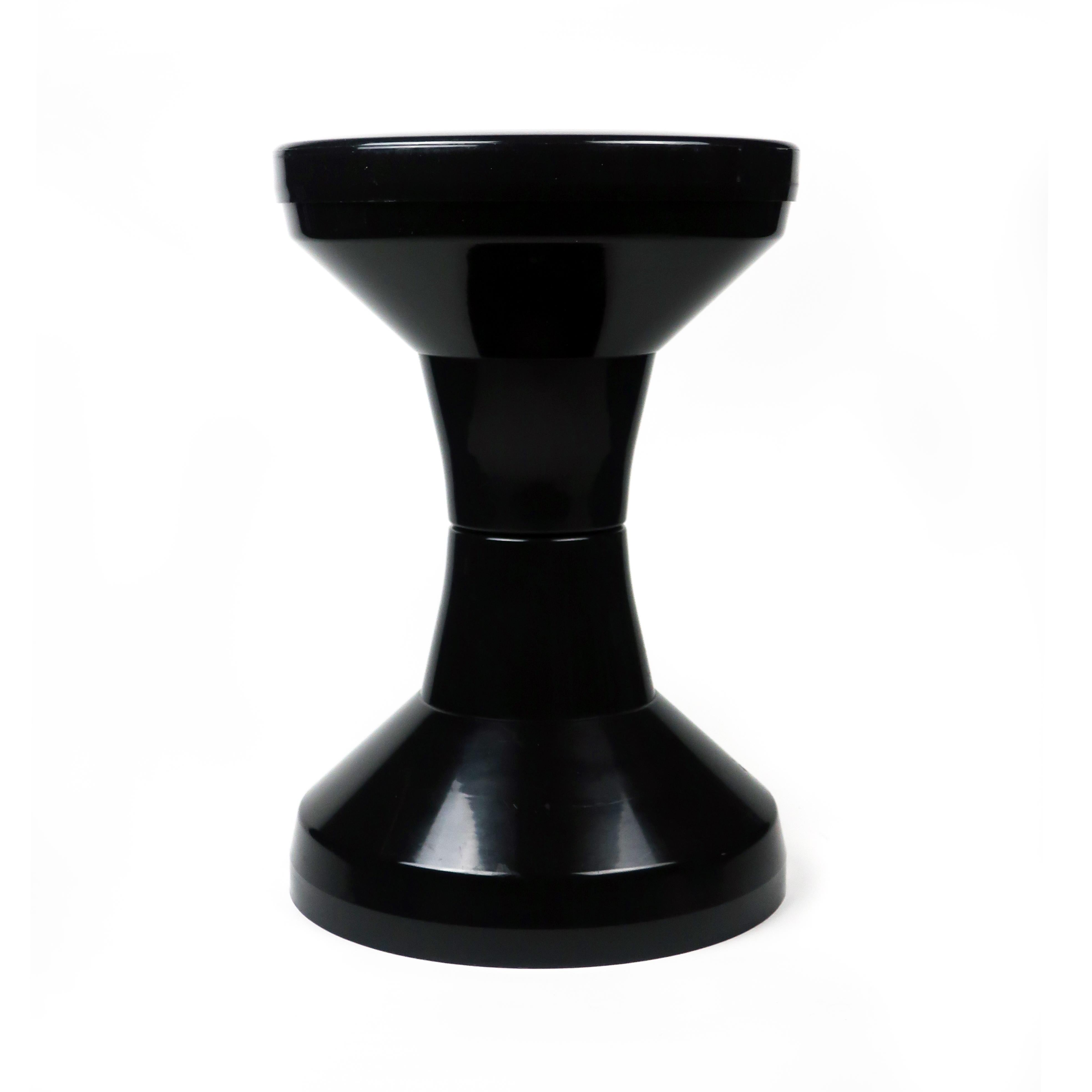 Originally thought of to be a fisherman’s stool, this vintage black plastic stool by Henry Massonnet has an iconic hour glass shape and became a classic of late 1960s design. Lightweight and versatile, it makes a great step stool, drink stand, side