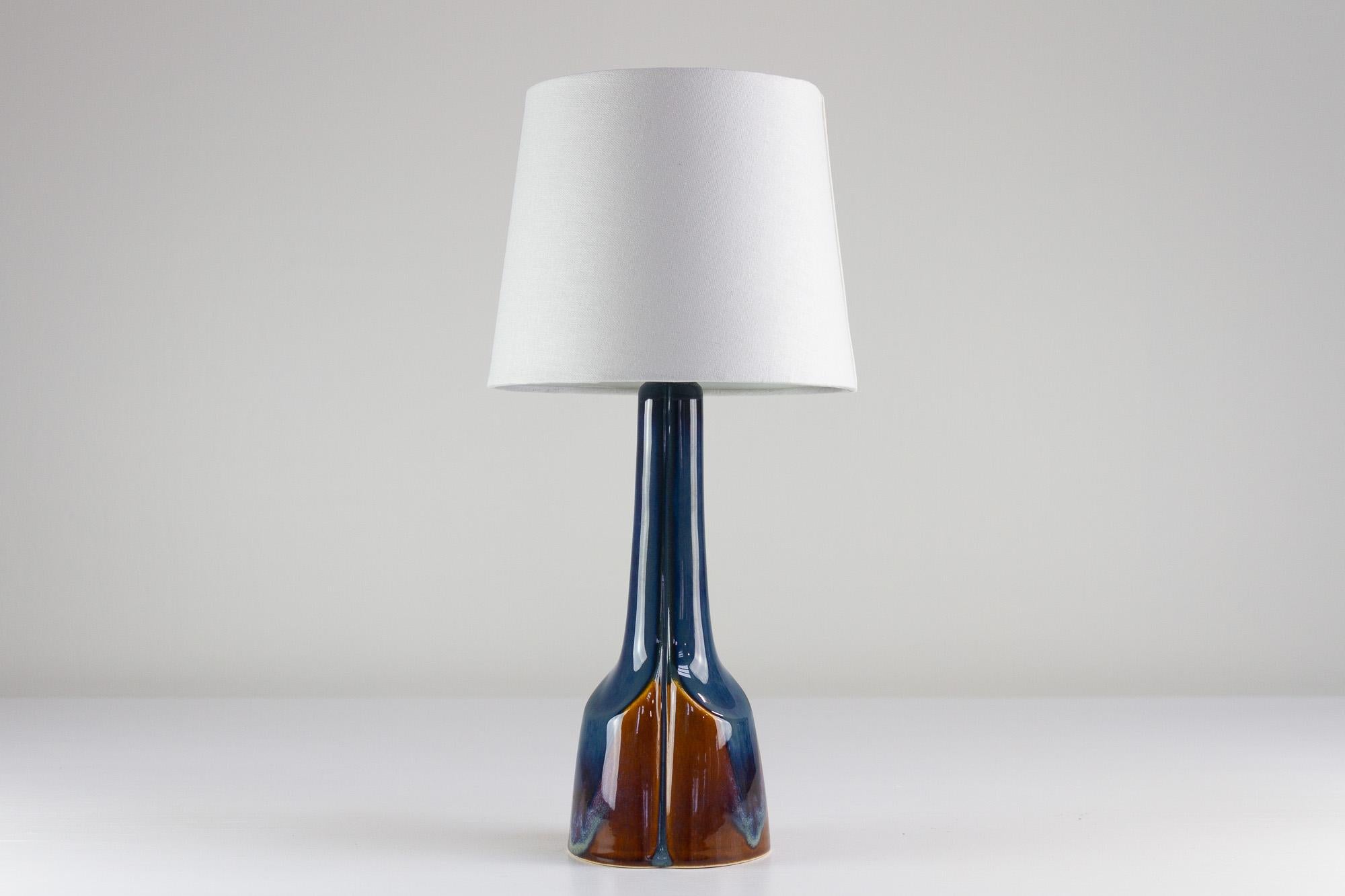 Danish Modern Blue and Brown Ceramic Table Lamp model 940 by E. Johansen for Søholm, 1960s.
Mid-Century Modern Danish blue and brown ceramic table lamp designed by Einar Johansen and handmade by Søholm, Denmark. Soholm is a Danish pottery on the
