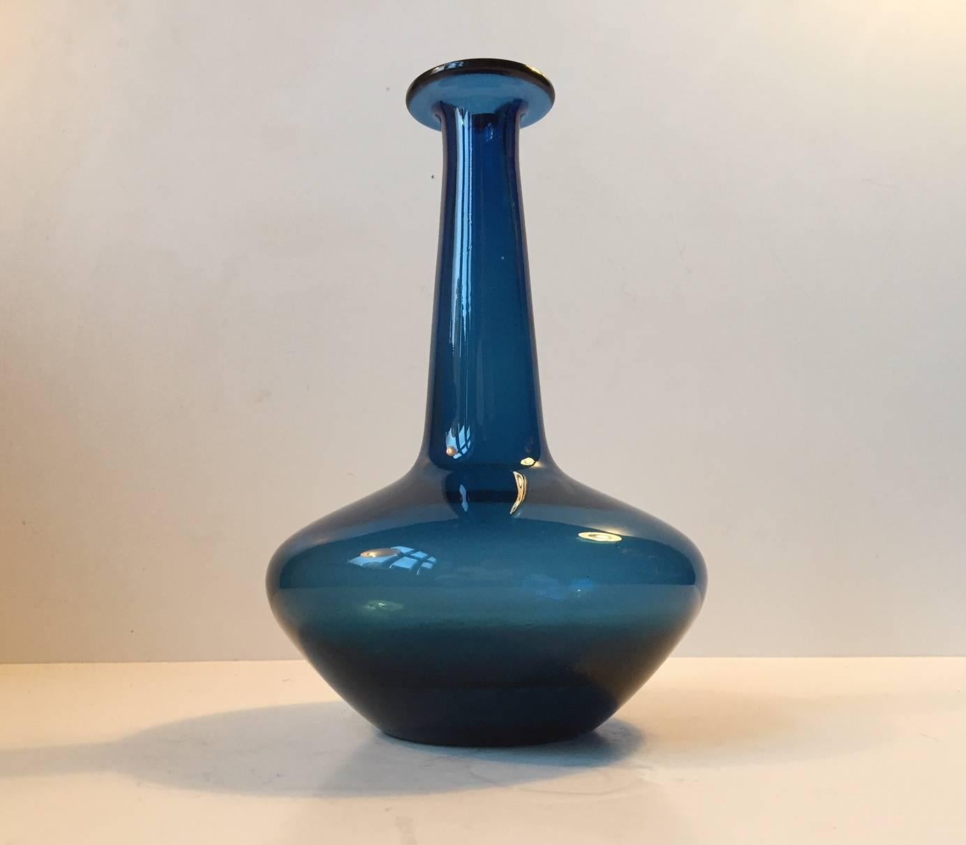 Organically shaped blue glass vase designed by Jacob E. Bang (Arne Bang's younger brother) and manufactured by Fyns Glasværk / Holmegaard in Denmark in the 1960s. The name Capri refers to the distinctive blue color.