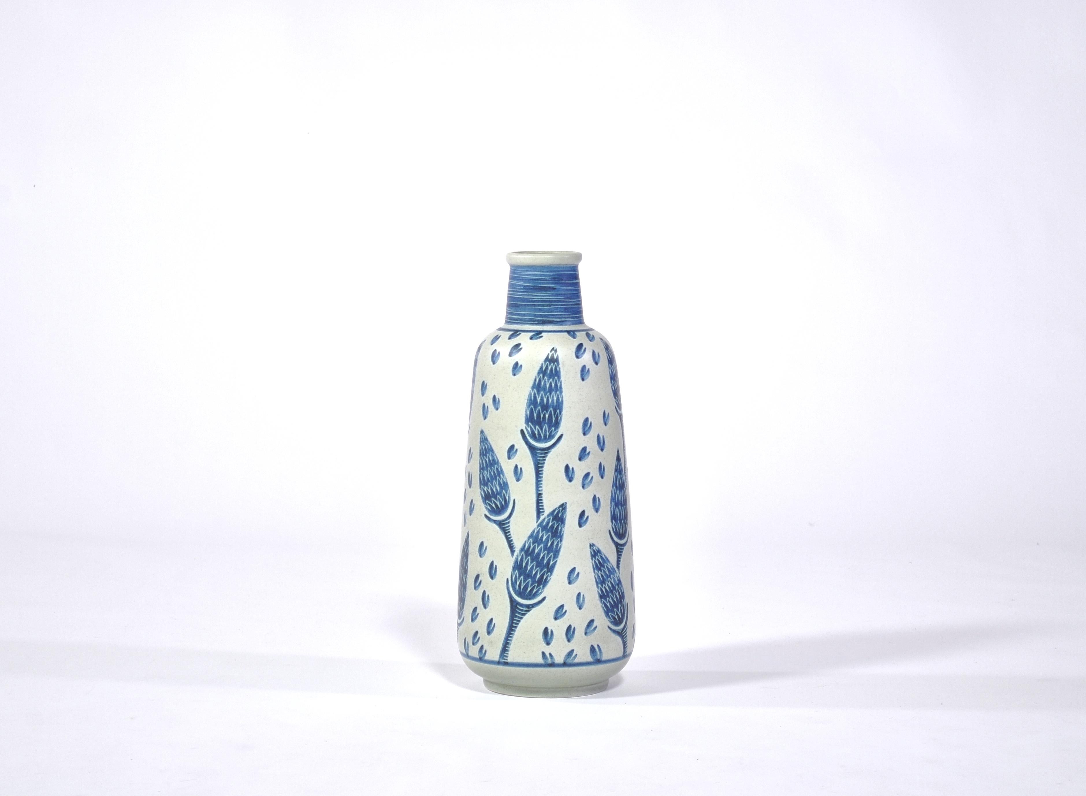 Hand painted floor vase from the 1960s by Danish artist Rigmor Nielsen at Søholm ceramics workshop, Bornholm. Each of these vases were made by hand and are unique in their decorations. This example features a beautiful corn motif in blue and white