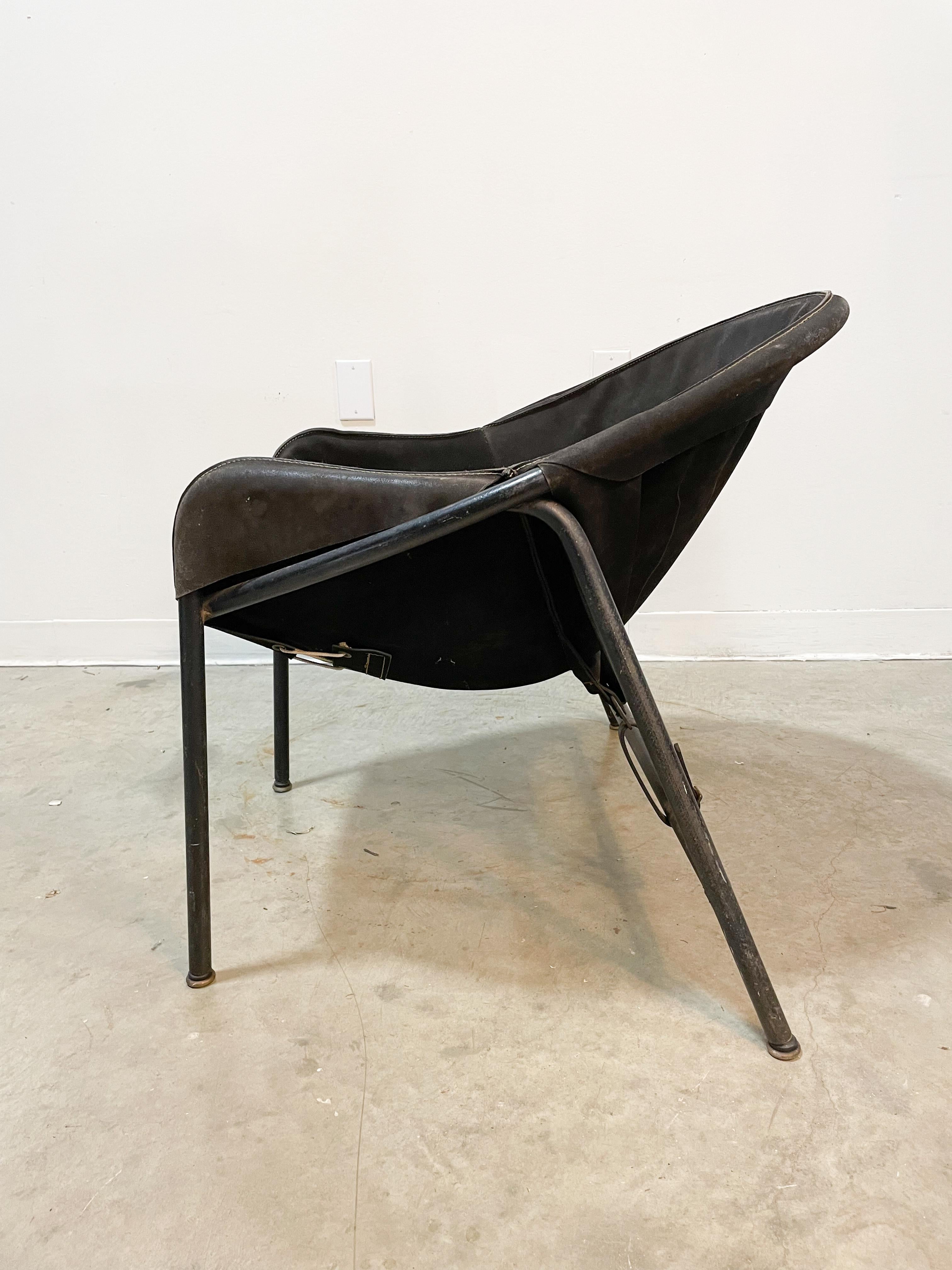 Early 1960s metal and suede hoop sling chair by designer Erik Ole Jorgensen made by Bovirke in Denmark. Deceptively comfortable, this sling lounge chair conforms to your body providing great support. All original black suede sling and leather straps
