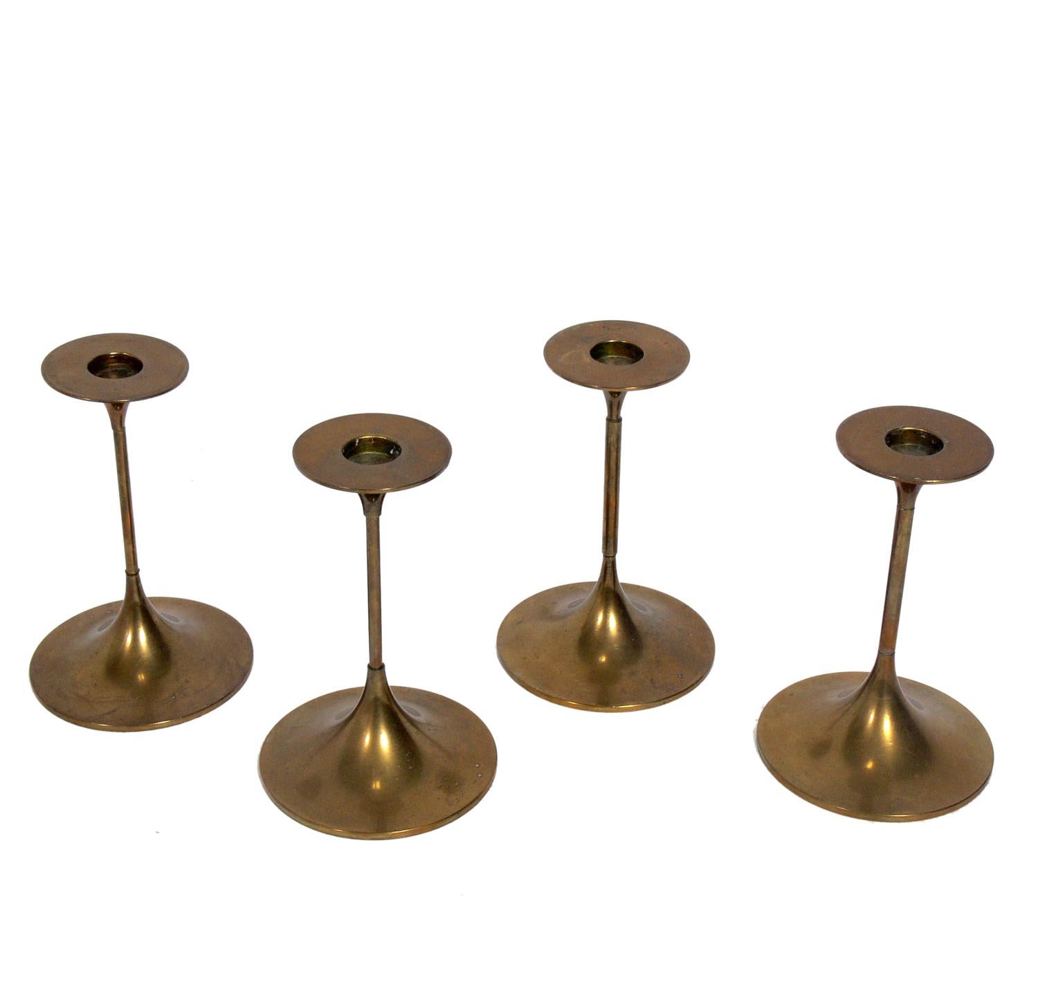 Danish modern brass candlesticks, designed by Max Bruel for Torben Orskov, Denmark, circa 1960s. They retain their warm original patina. They are priced at $175 each.