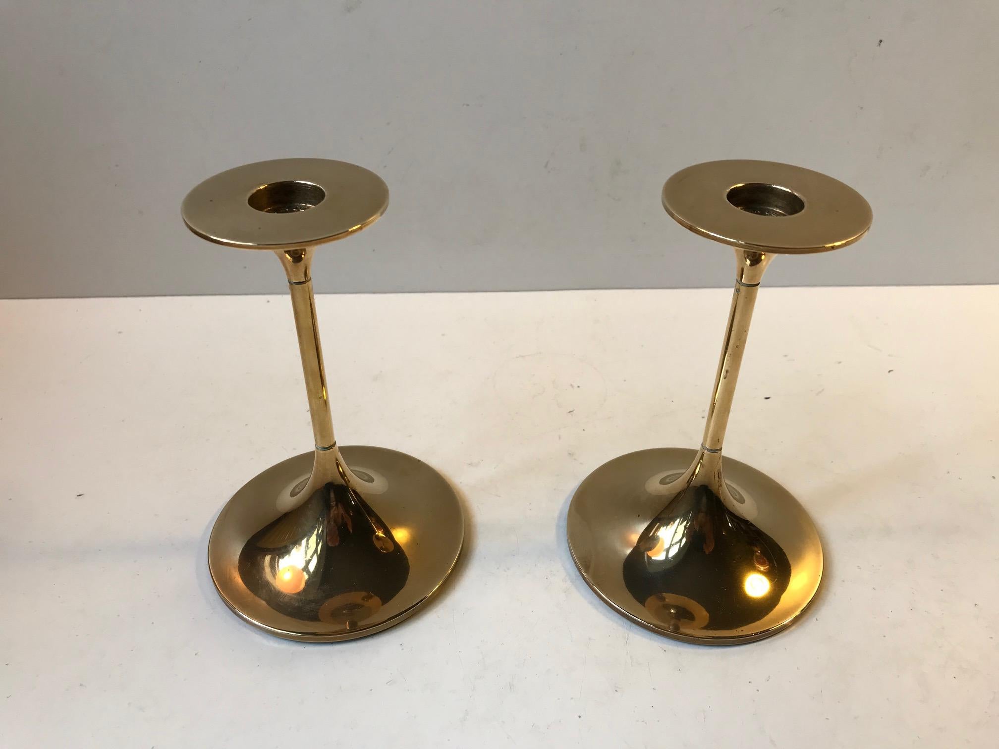 A pair of solid brass candlesticks designed by Architect Max Bruel. The model is called Hi-Fi and was manufactured by Torben Orskov in Denmark during the 1960s. They are imprinted from the manufacturer, both to the top and bottom. Although the