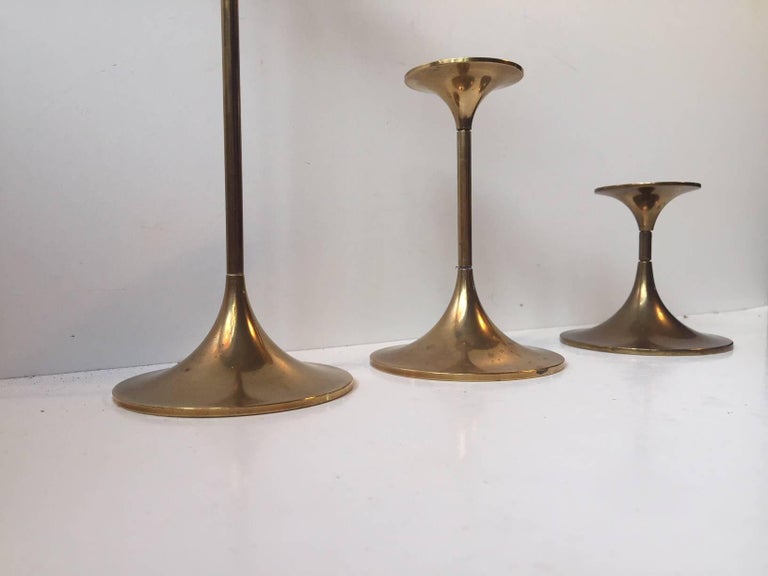 A set of three solid brass candlesticks designed by Architect Max Bruel. The model is called Hi-Fi and was manufactured by Torben Orskov in Denmark during the 1960s. These Minimalist candlesticks features unscrew'able joints in different sizes so