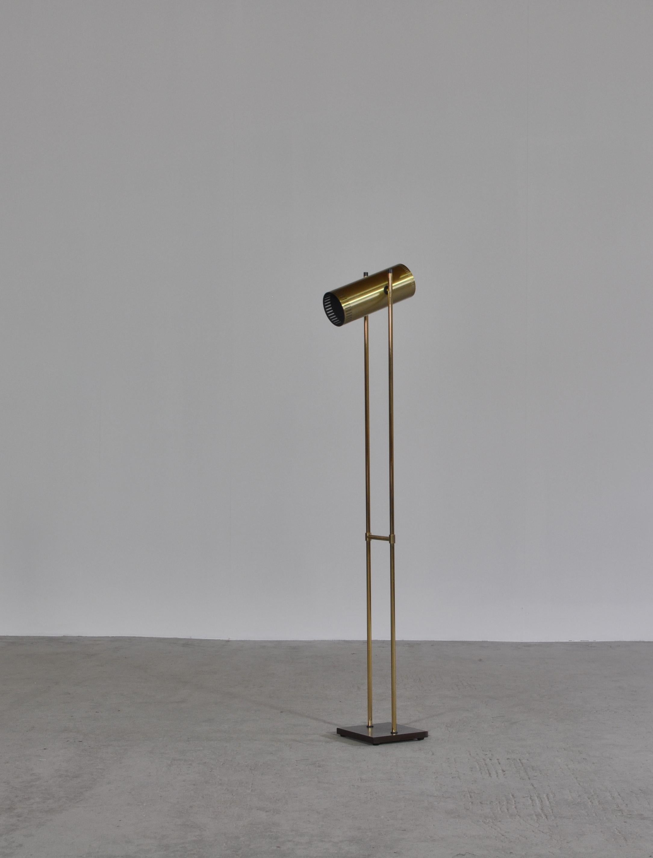Elegant floor lamp in solid brass by Danish Designer Jo Hammerborg. The lamp shade is adjustable in all directions. It was manufactured by Fog & Morup in the late 1960s and the brass edition is a rare find today. Great vintage condition with label