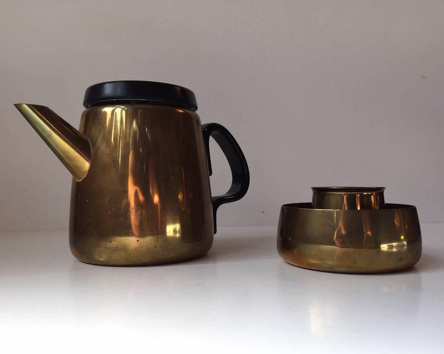 This spectacular Danish modern 3-piece brass tea or Mocaa set is designed Danish Architect and Silversmith Henning Koppel and manufactured by Georg Jensen in Denmark during the 1950s. Its simplicity at its best! It's in great vintage condition with