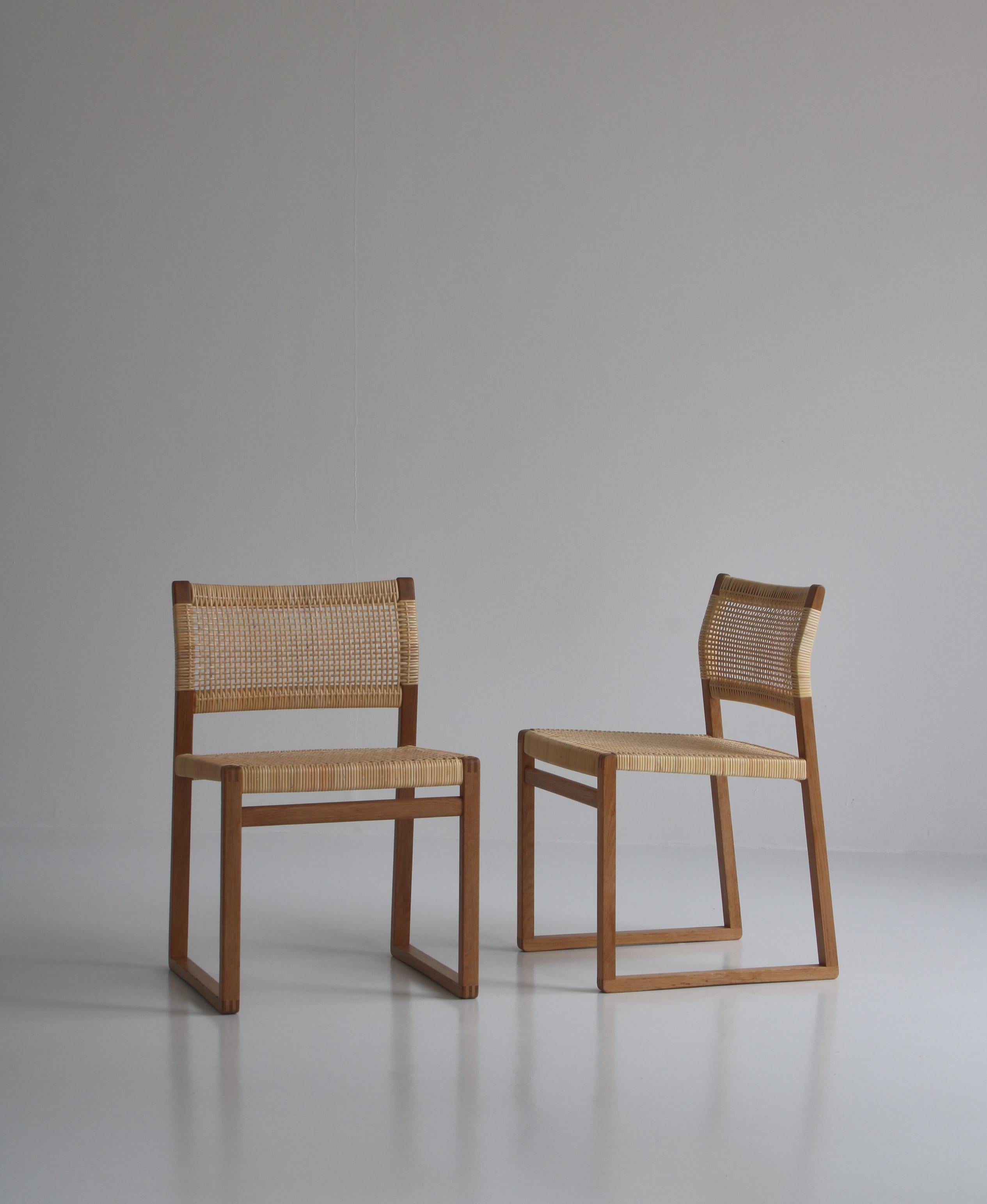 Vintage Danish Modern chairs in oak and rattan cane designed by Danish designer Børge Mogensen in the 1950s and manufactured at 