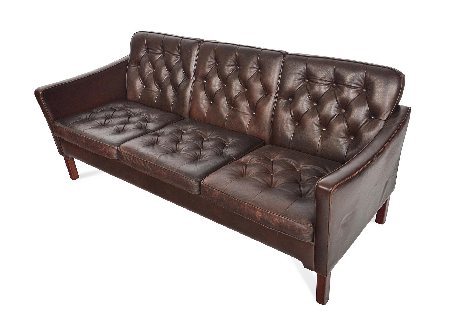 brown button sofa