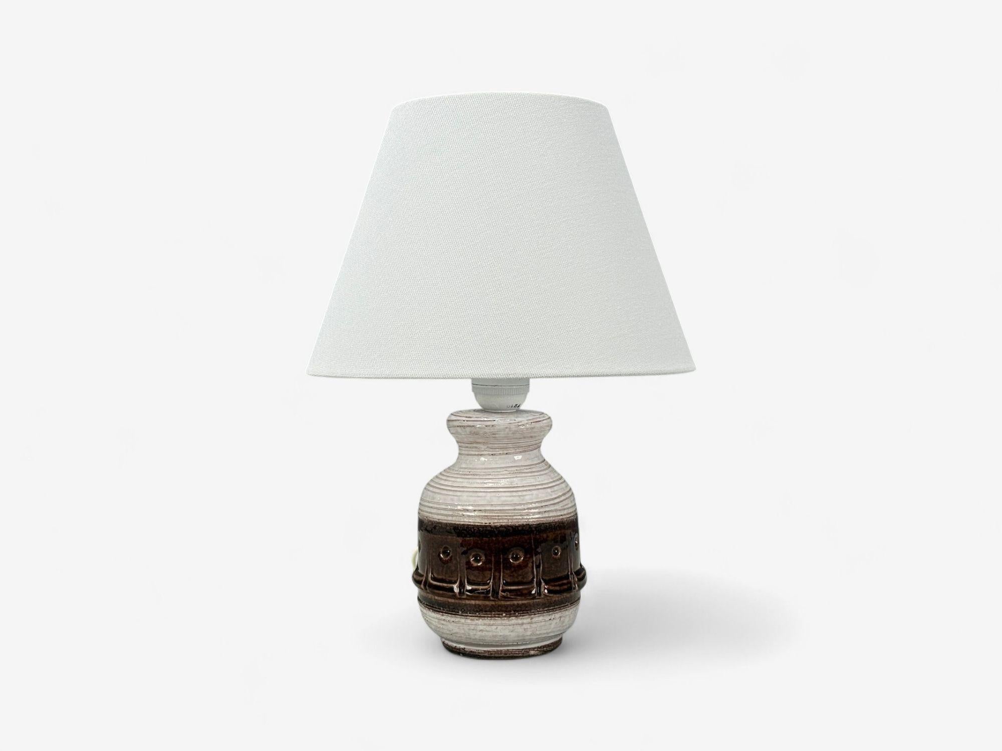 Danish Modern, Brown Stoneware, Table Lamp, Denmark, 1960s

A modernist white and brown glazed table lamp produced by an unknown ceramicist in Denmark in the later half of the 20th century. Will be re-wired upon purchase.

Brown and White Stoneware,