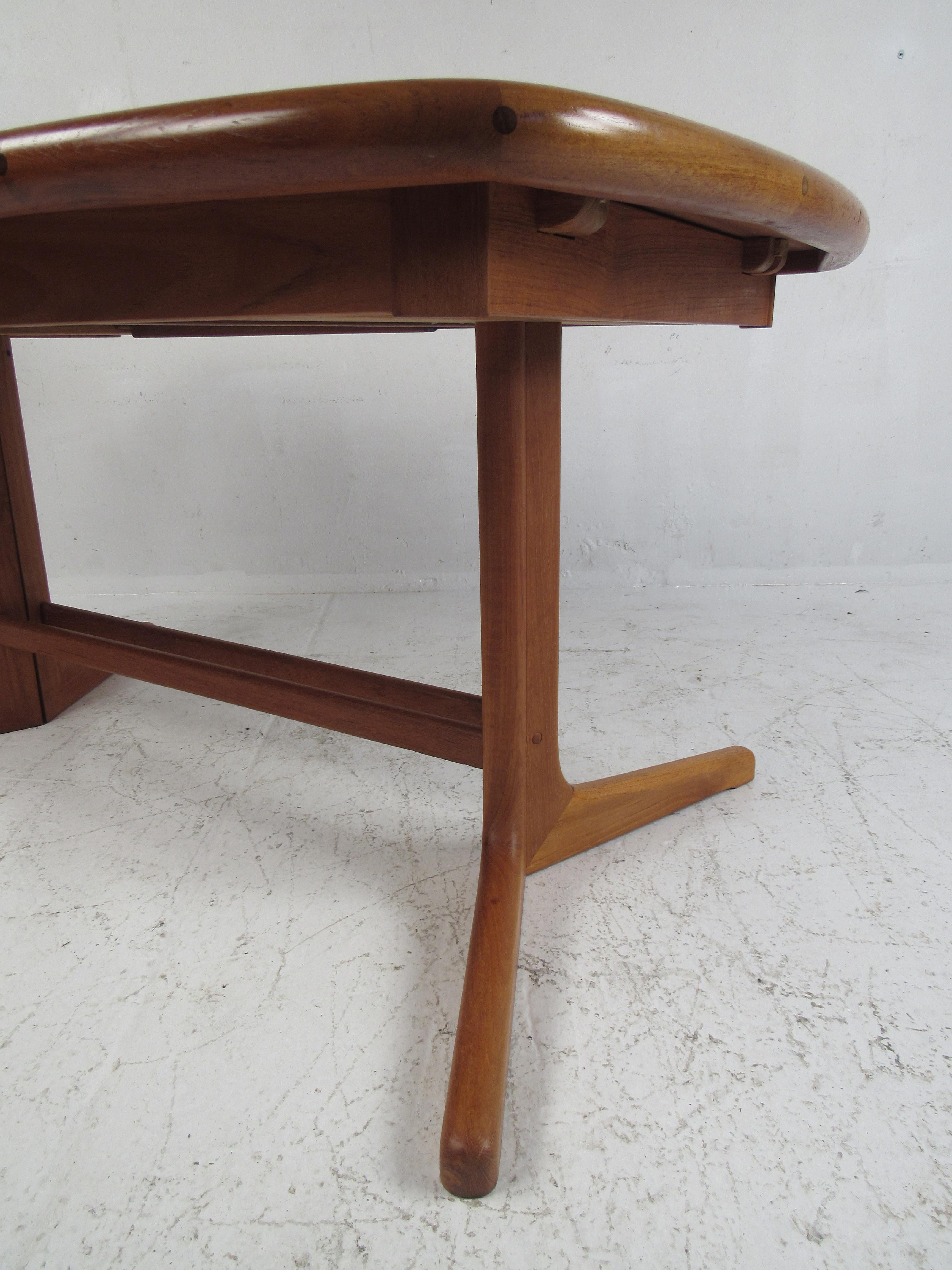 Mid-Century Modern Danish Modern Butterfly Leaf Dining Table with a Pedestal Base