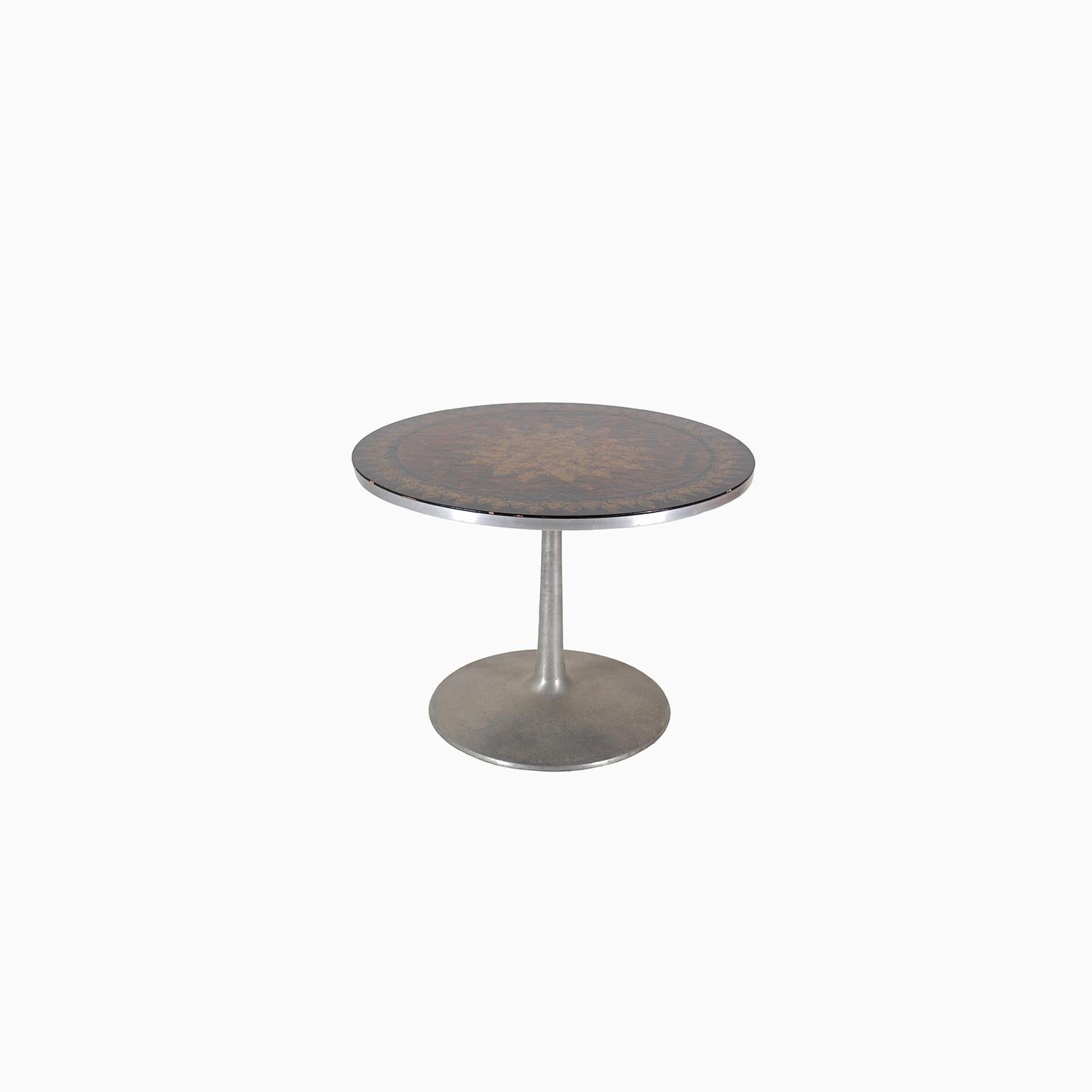 A Danish Modern tulip table made of aluminum and hand painted by Susanne Feljdose. Produced by Cado. 

Professional, skilled furniture restoration is an integral part of what we do every day. Our goal is to provide beautiful, functional furniture