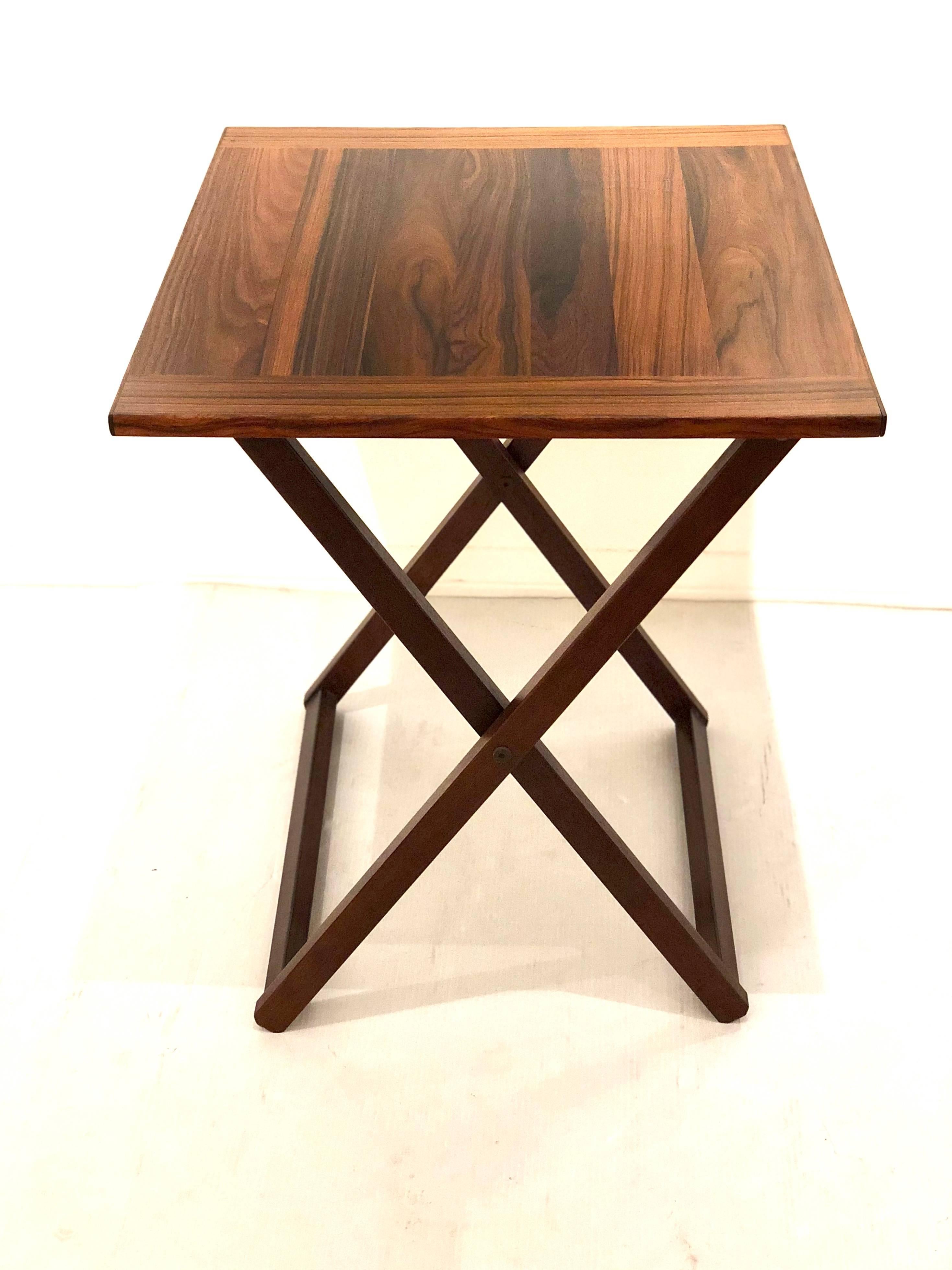Beautiful grain on this freshly refinished rosewood folding table simple and elegant lines easy to store, versatile and elegant.