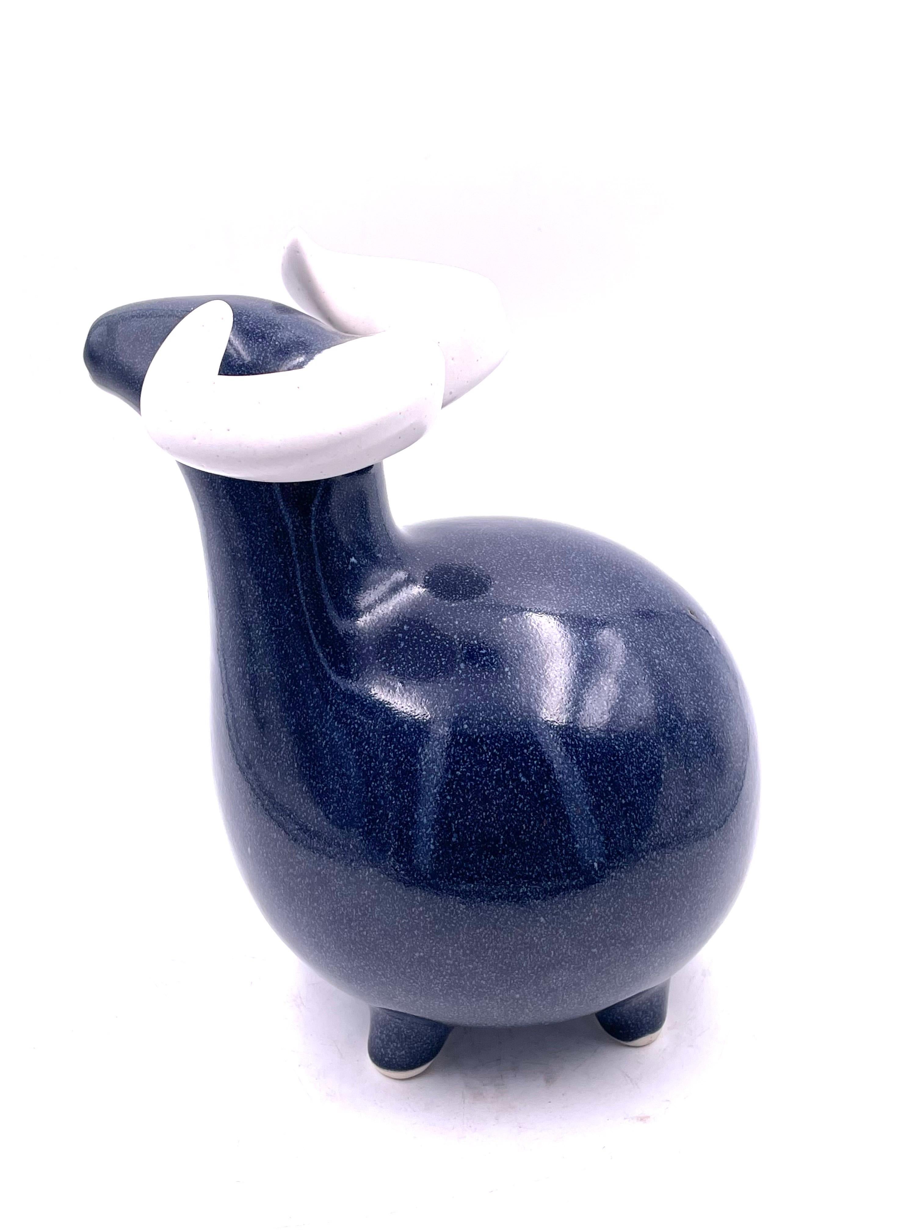 Beautiful glaze on this ceramic ram sculpture from 1980s. we believe it's made by Arabia of Finland but it's unmarked.