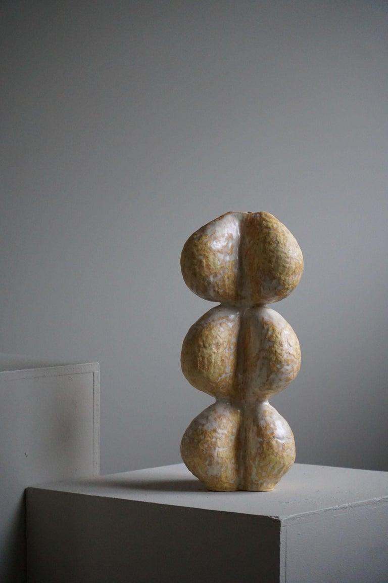 Ceramic vase with glaze in variations of white and yellow colors, made by Danish artist Ole Victor, 2022.

Ole Victor is a Danish artist who attended Art Academy between 1975 and 1980. He creates artworks and ceramics ever since. Hes been exhibited