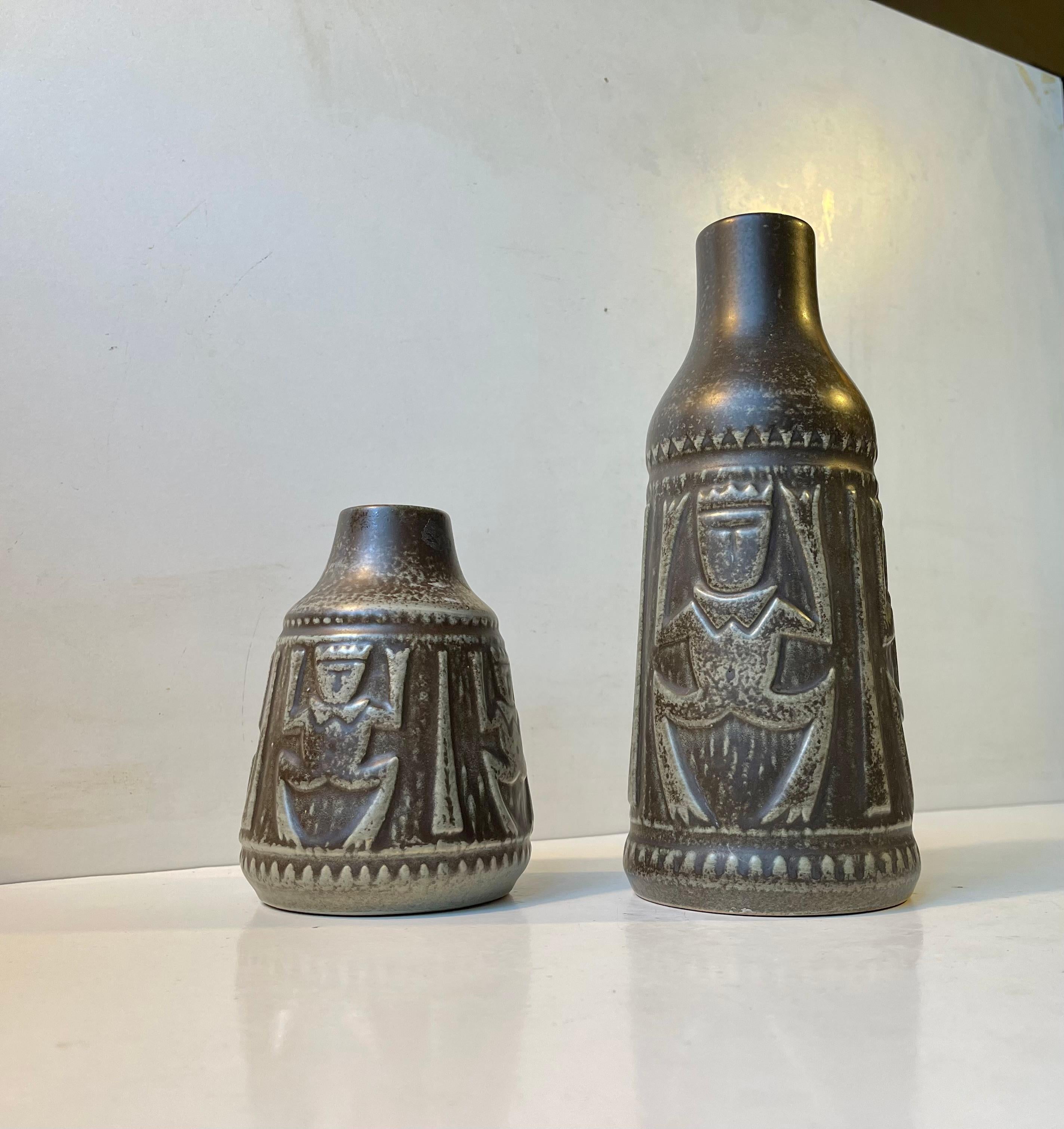 Ceramic vases with grey/brown/green'ish glaze and decorated with Bornholm trolls Designed and manufactured during the 1970s by Johgus on the Island of Bornholm in Denmark. Both signed. Measurements: H: 24/14 cm, D: 10/10 cm. The price is for both.