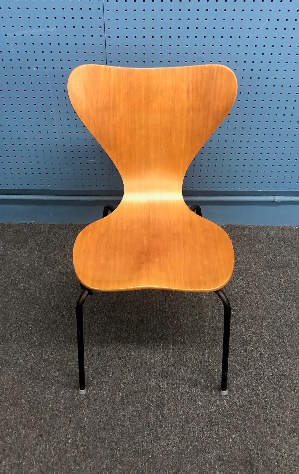 A very rare Danish modern chair in teak by Herbert Hirche for Jofa Stalmobler, circa 1950s. The chair was made in Denmark of thick plywood with teak veneer; the base is black painted tubular steel. The piece is structurally sound and sits great!