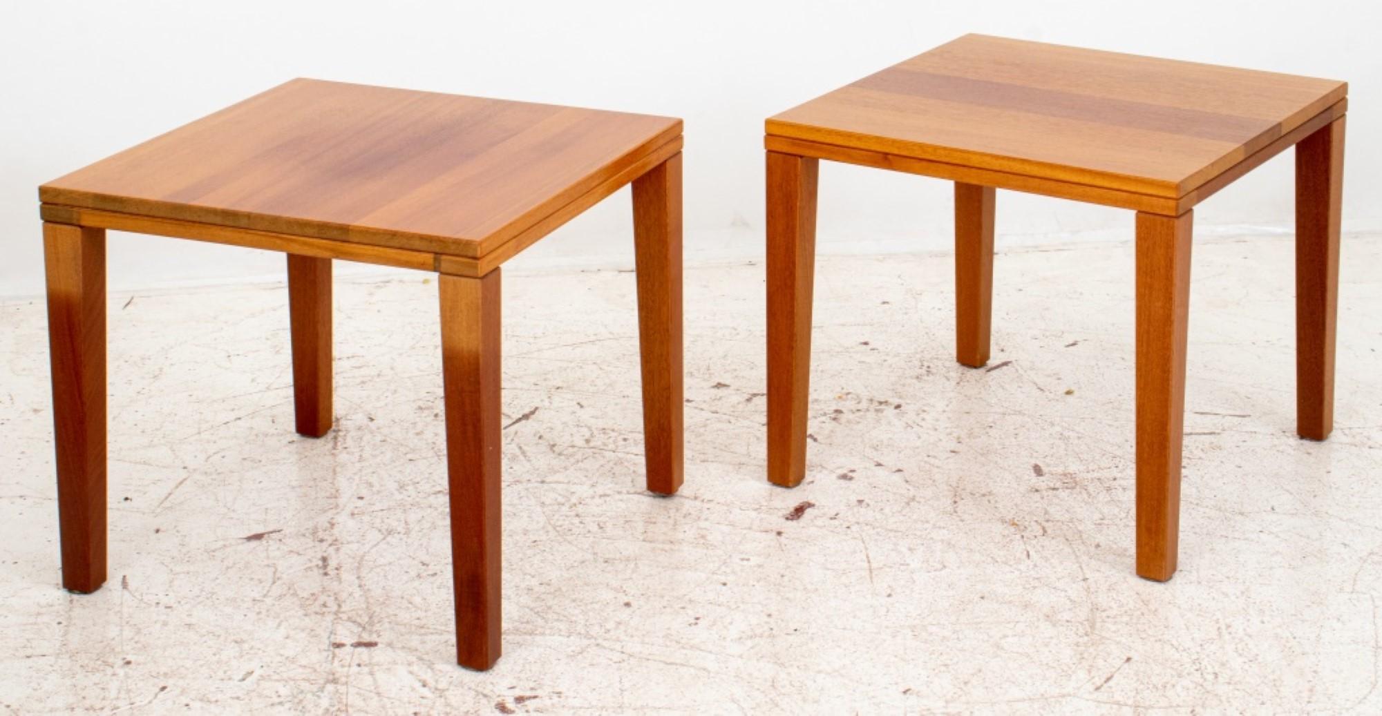 Pair of minimalist Danish Modern cherry wood square side tables, raised on tapered legs. Provenance: Property from the Manhattan apartment of the Danish Ambassador to the United Nations.