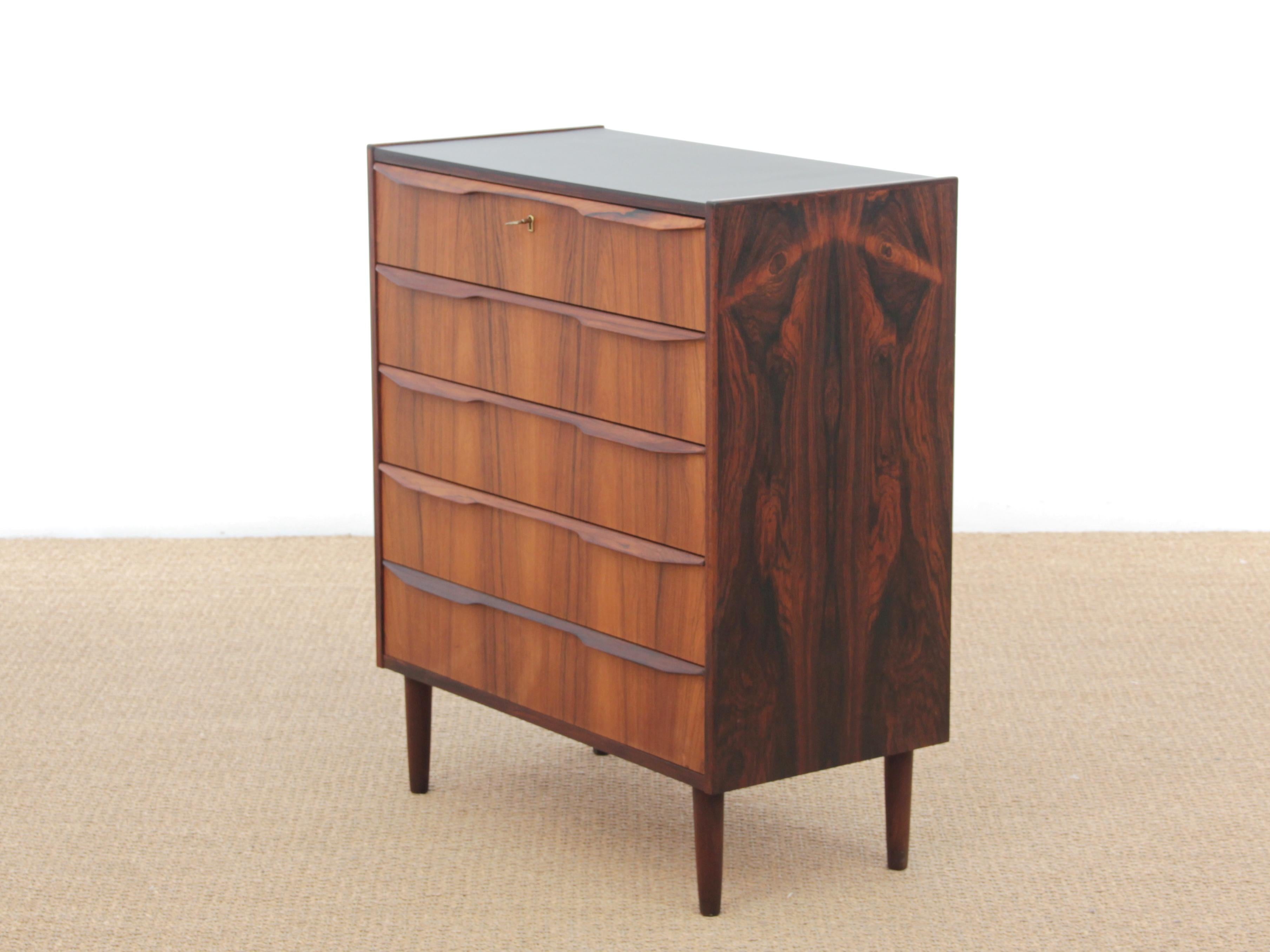Danish modern chest of drawers in rosewood. Top in black Melanie.