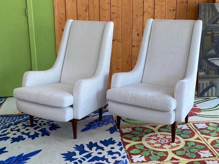 Beautiful Danish modern club chairs,
circa 1960. New white cotton velvet upholstery. Polished wood feet. In very good condition.