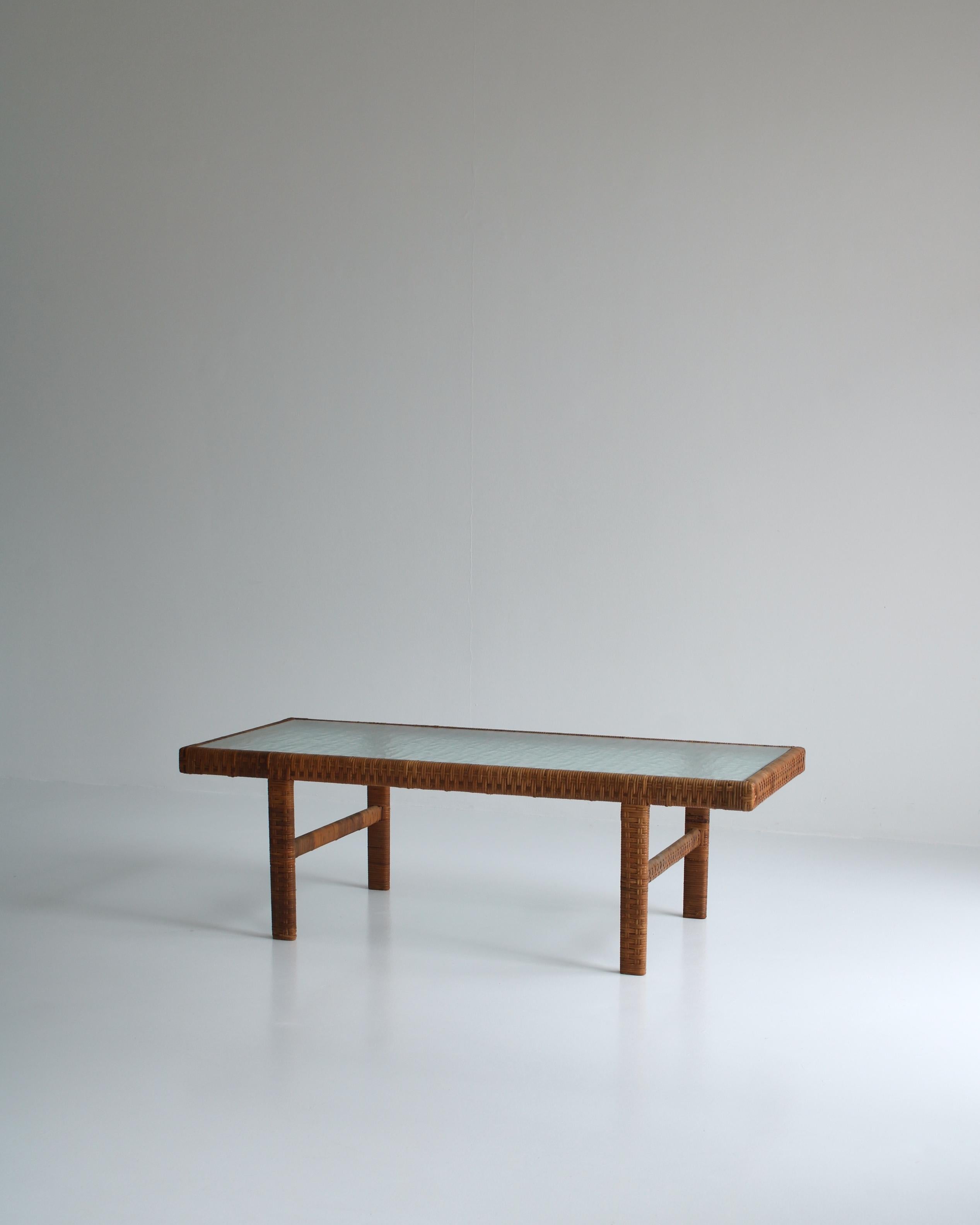 1940s Danish coffee table attributed to cabinetmaker R. Wengler, Copenhagen. The base is made from wood wrapped with rattan cane and the table top is matt / frosted glass. Beautiful patina to cane and original glass in great condition.