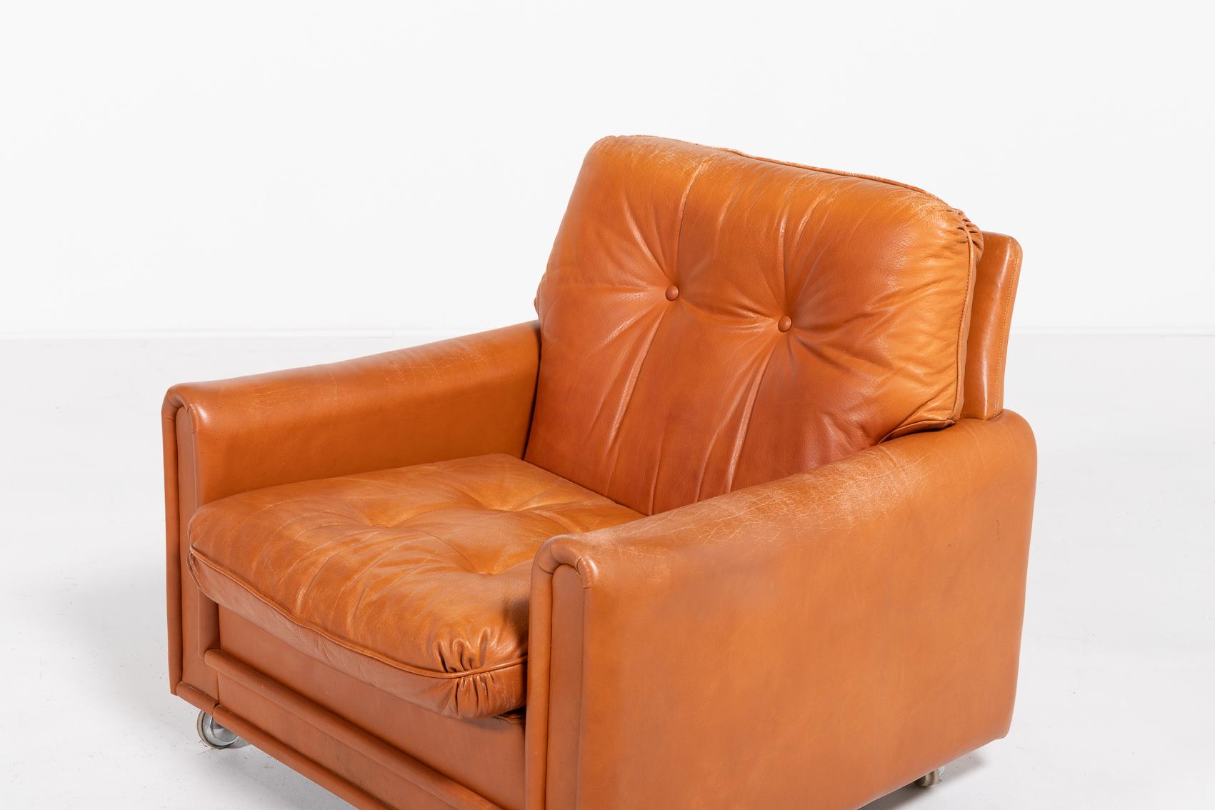 Danish Modern pair of lounge armchairs produced in 1960’s. The armchairs are upholstered in cognac leather, equipped with wheels.

Condition
Good, age related wear and patina

Dimensions
width: 80 cm.
height: 76 cm
depth: 83 cm
seat height: 38 cm