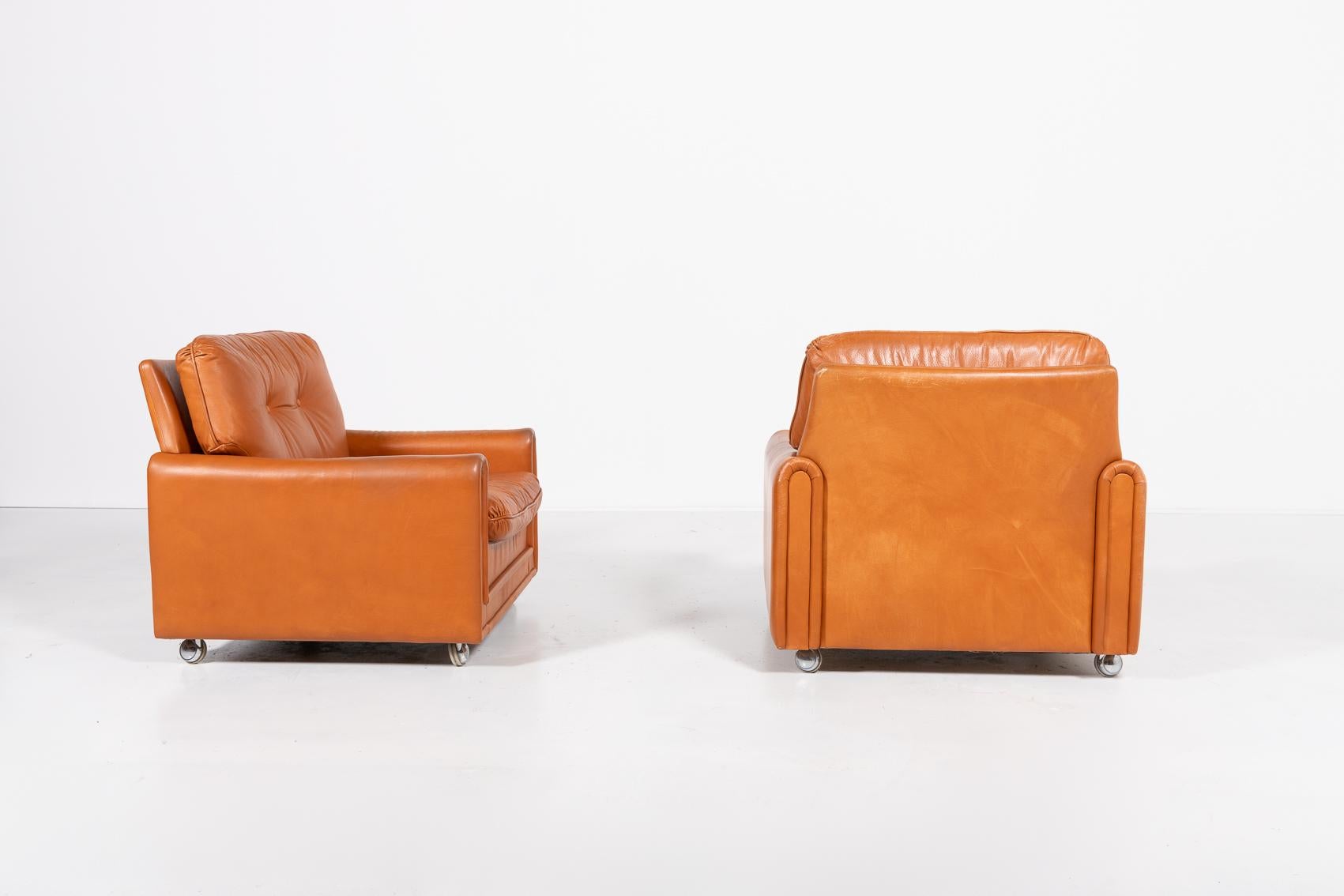 Leather Danish Modern cognac leather armchairs from 1960’s For Sale